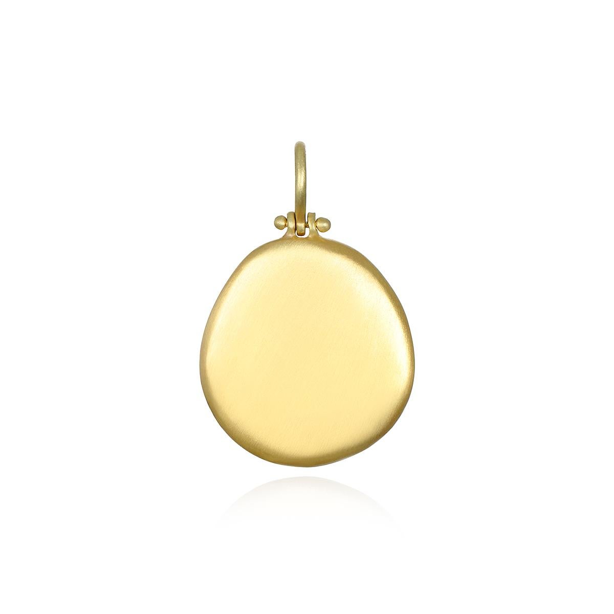 Versatile and easy to wear, Faye Kim's popular 18 Karat Gold Hinged Dog Tag Pendant is perfect for every day. The pendant is matte-finished and shown on an 18
