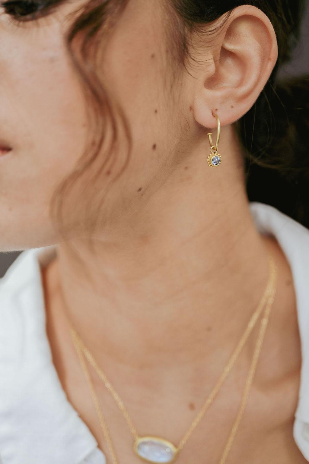 Faye Kim's must-have 18 karat gold hoops on posts. A classic look, timeless in design. Shown here with our Ceylon Blue Sapphire granulation drops to add sparkle, color, and versatility. Stylish and great for daily wear, with or without the