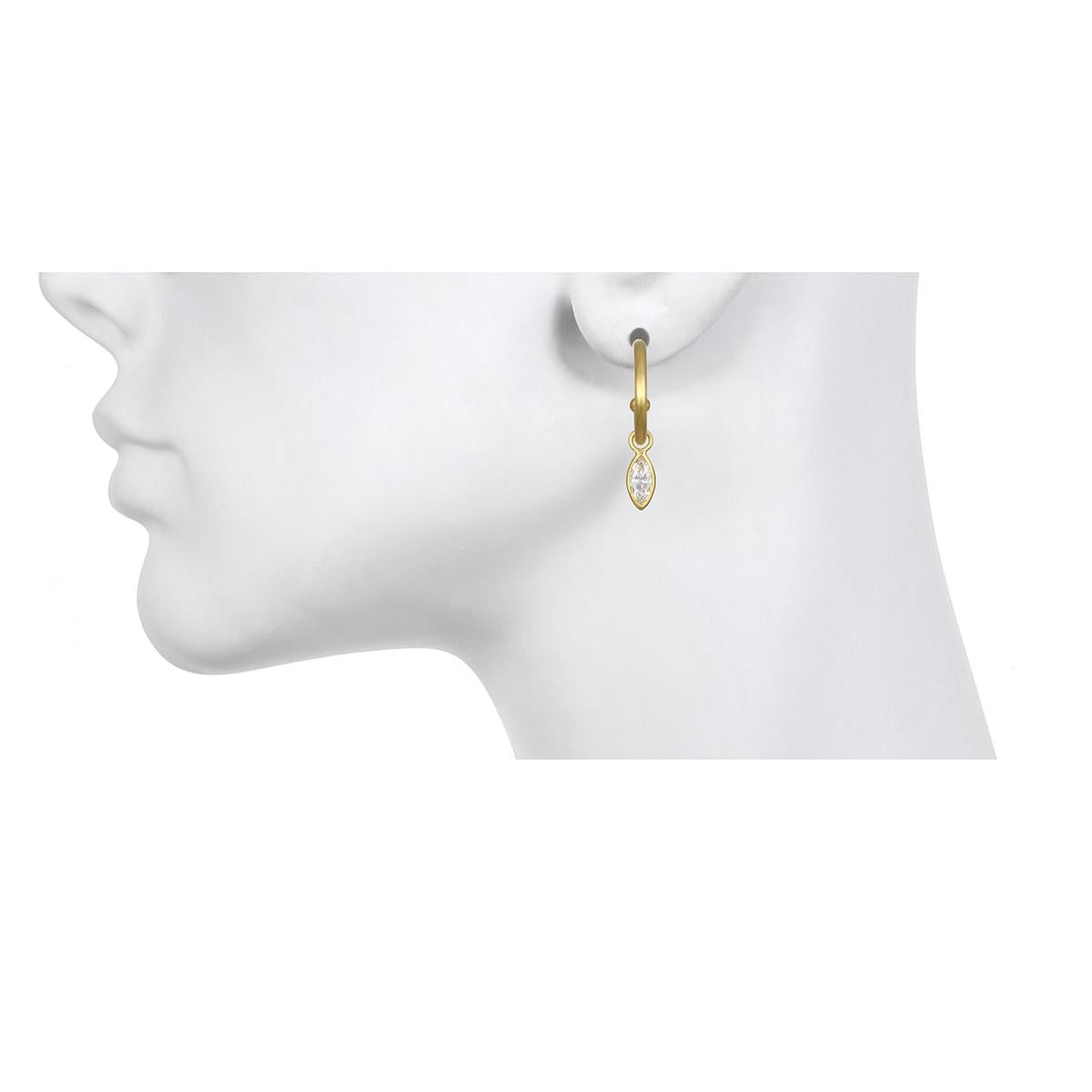 A perennial favorite. Faye's  18k gold post hoops sparkle with interchangeable bezel set Marquise diamond drops. Just the right amount of dazzle for the modern woman. Comfortable and transition from day to evening seamlessly. 

Earrings as