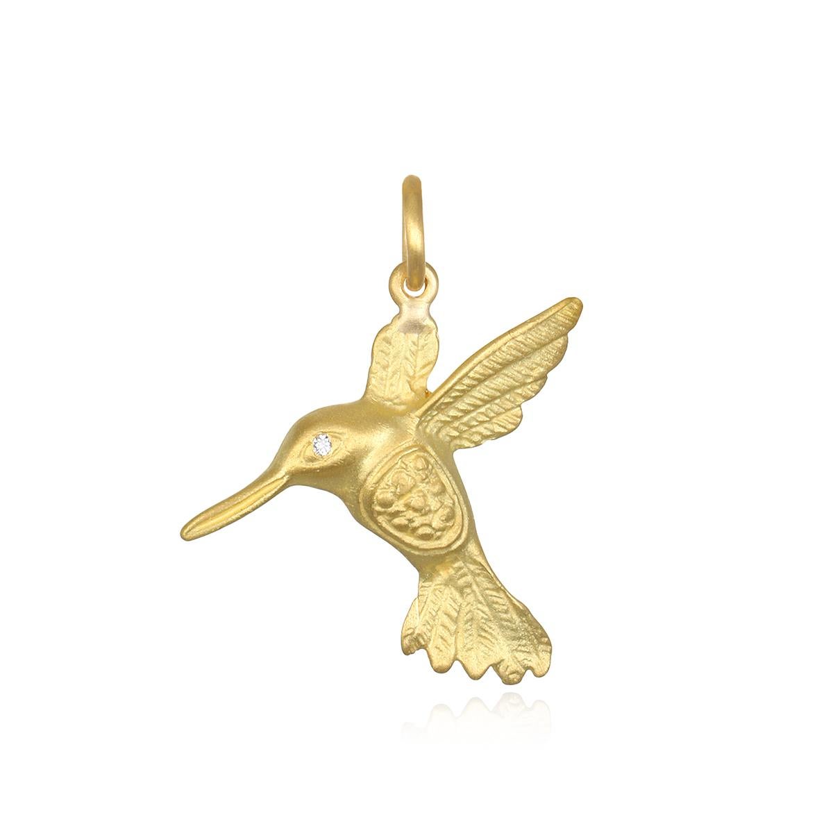 Faye Kim's 18 Karat Gold Hummingbird, part of the designer's Signature Charm Collection, features a sparkly diamond eye and can be sold separately from the chain or soldered onto one of our wire bangles. Each charm makes a design statement on its