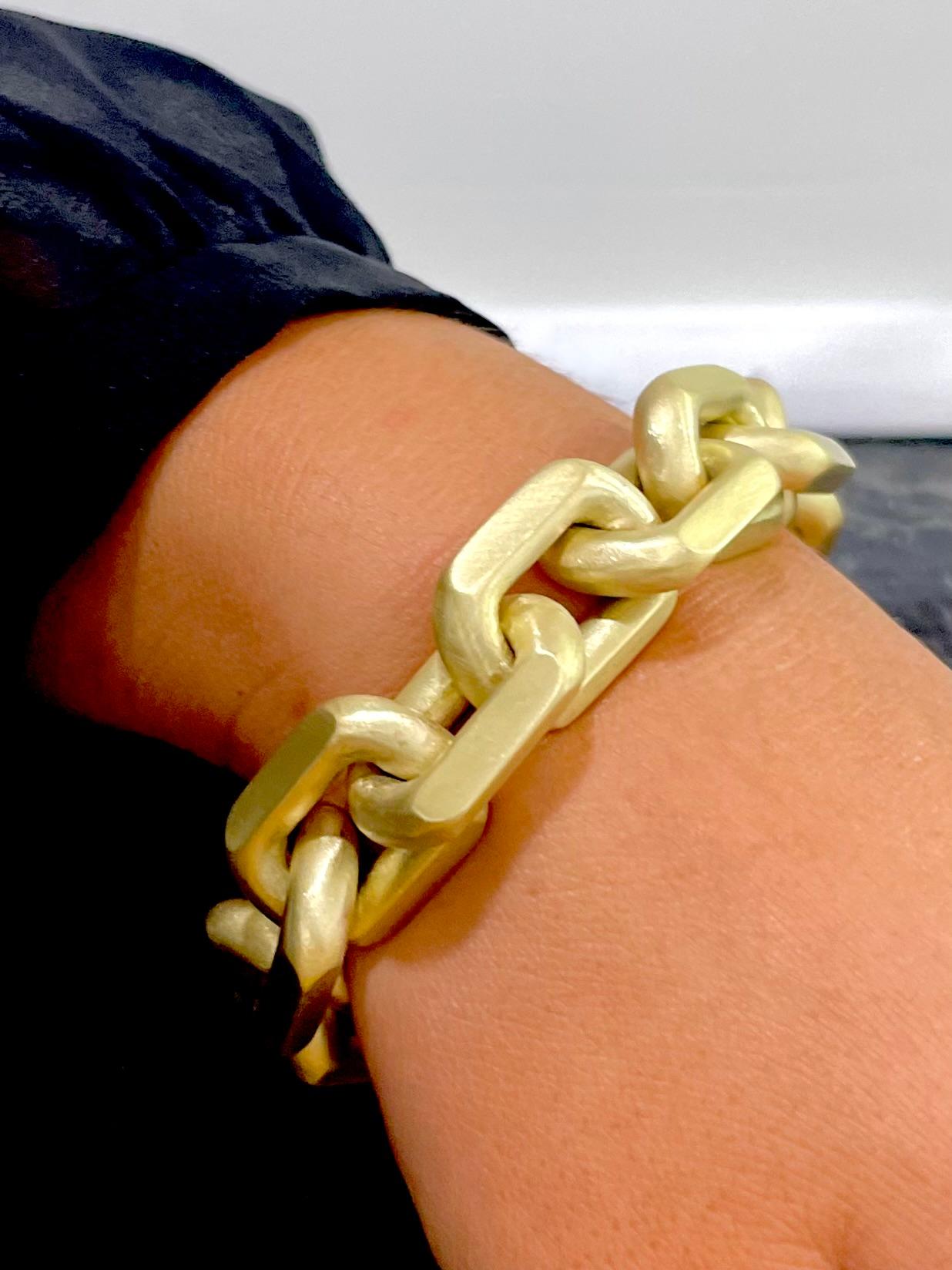 A one-of-a-kind stunner, Faye Kim's handcrafted 18 Karat Gold Knife Edge Link Bracelet is quite substantial in weight and style. Each matte-finished link is has been masterfully designed to connect seamlessly from one to the next, and is completed