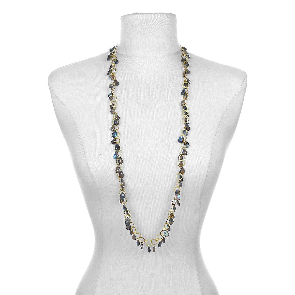 Faye Kim's spectacular 18 Karat Gold Labradorite Briolette Fringe Necklace conveys a modern design that offers understated elegance and a truly stylish, everyday look. Labradorite, which is treasured for its remarkable play of color, is believed to