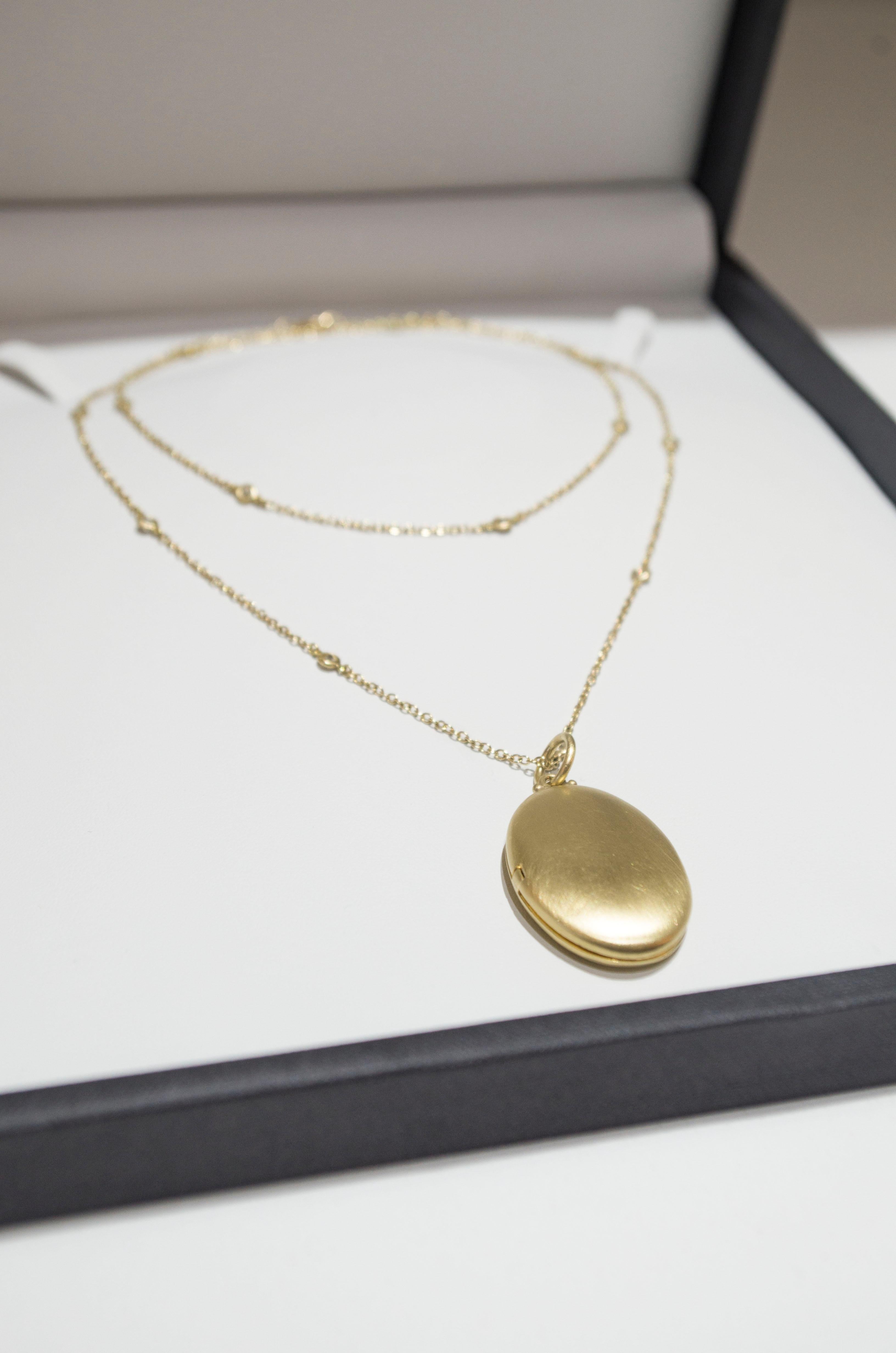 18 karat gold locket necklace