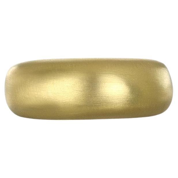 Faye Kim's 18 Karat Gold Low Dome Ring, with its clean, understated design and smooth, polished finish, can be worn alone or paired with other stacking rings. The ring's slightly chunky and effortlessly chic style enables it to be incorporated into