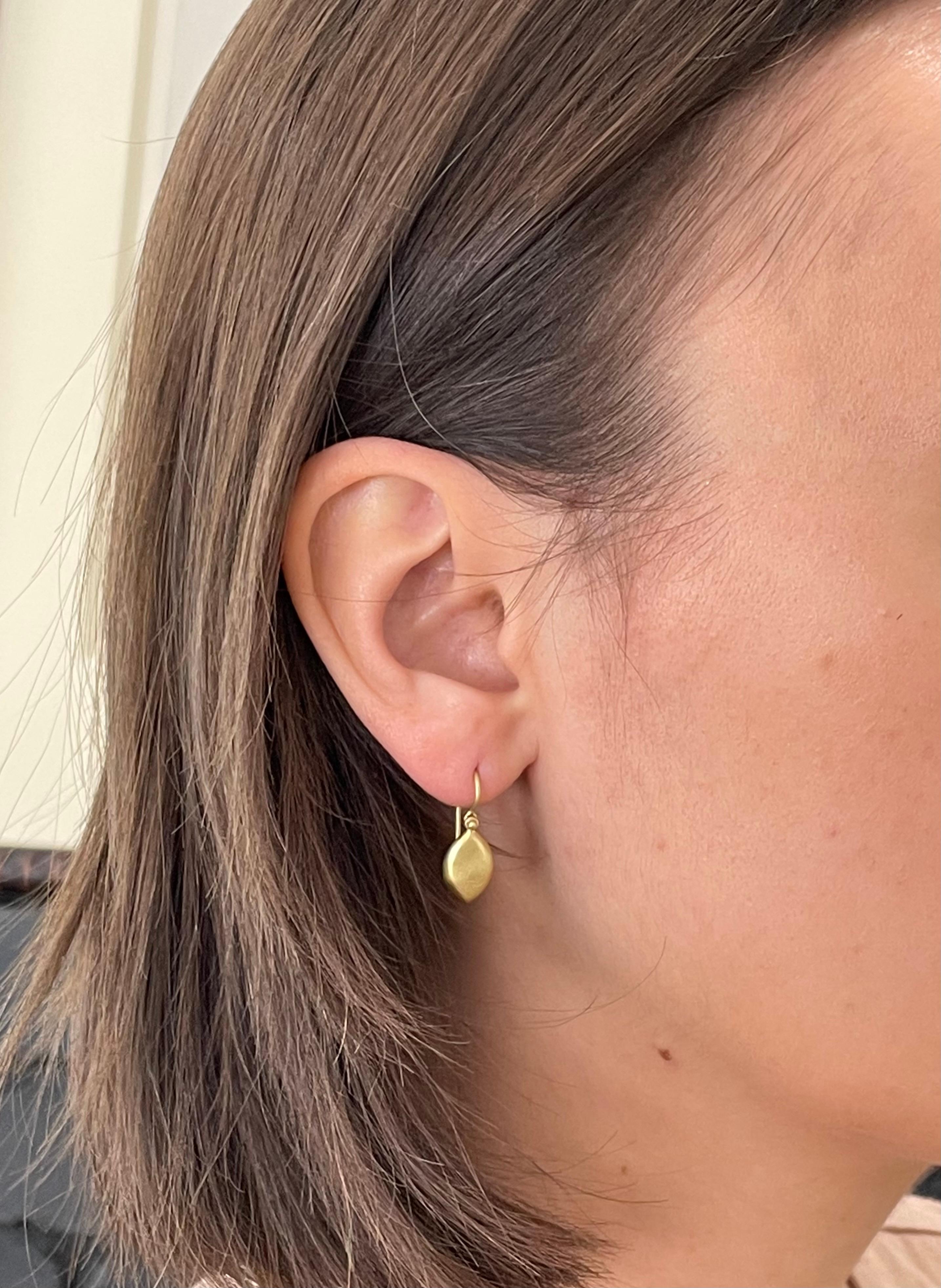It's all in the details. Faye Kim's signature 18K green gold earrings are finished with hinged ear wires to allow for movement. Certain to turn heads with its clean, sleek, and modern design! Matte-finished and perfect for every day.
Earring length