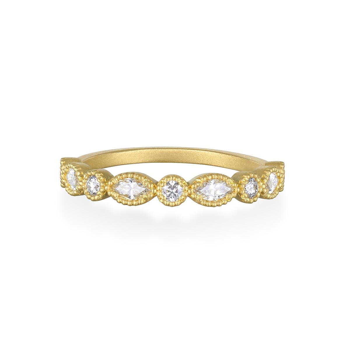 Worn alone or stacked, Faye Kim's 18 Karat Gold Marquise/Round Diamond Half Eternity Band would be a great addition to your jewelry collection. 

Classic half eternity band with a Milgrain edge detail, the bright white diamonds, with their