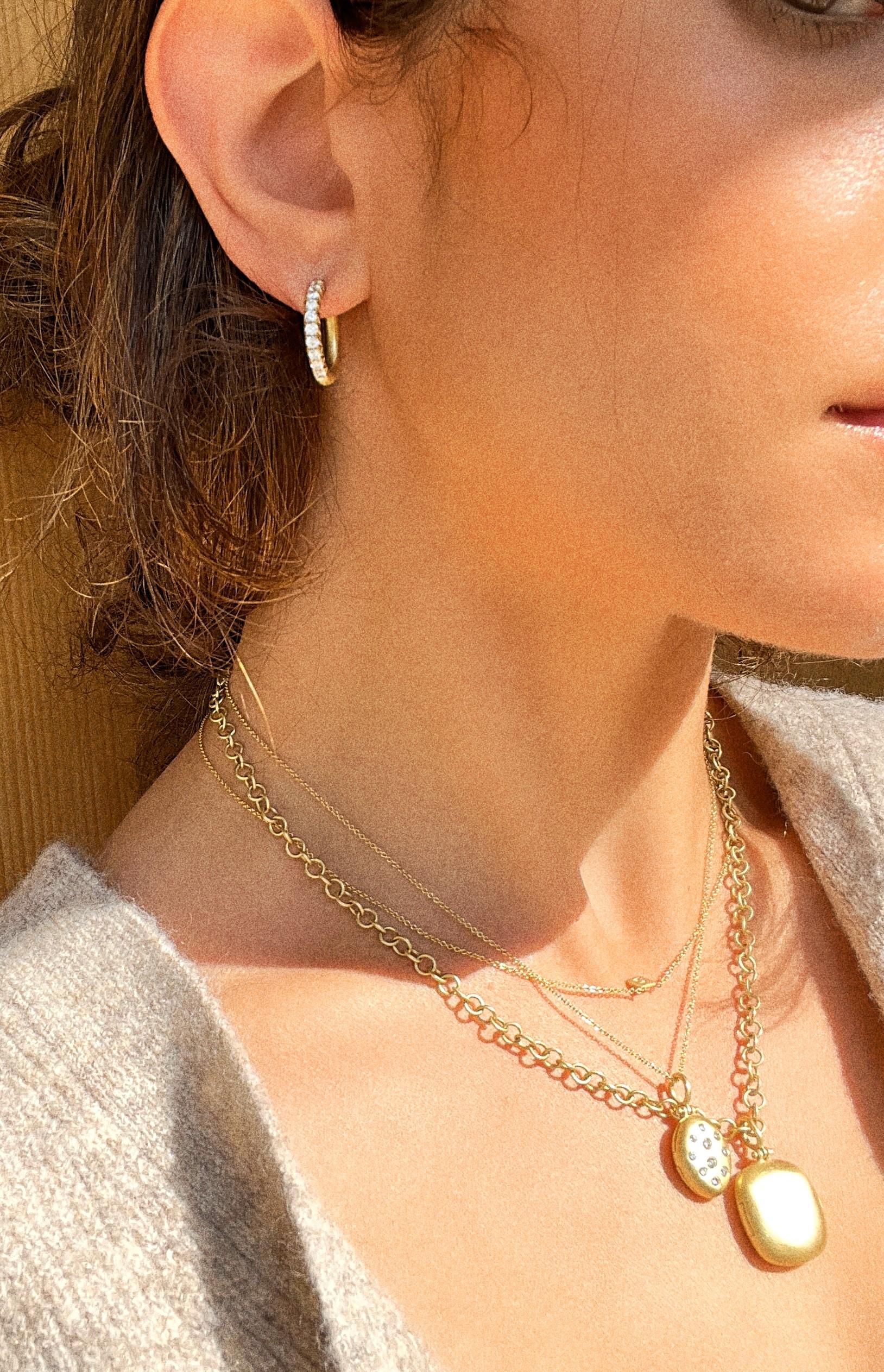 Faye Kim's modern yet timeless 18 Karat Gold Micro Pave Diamond Medium Hinged Hoop Earrings will complement any style and wardrobe, adding sparkle to every occasion! 

Diamonds .81 tcw
Earring length .5