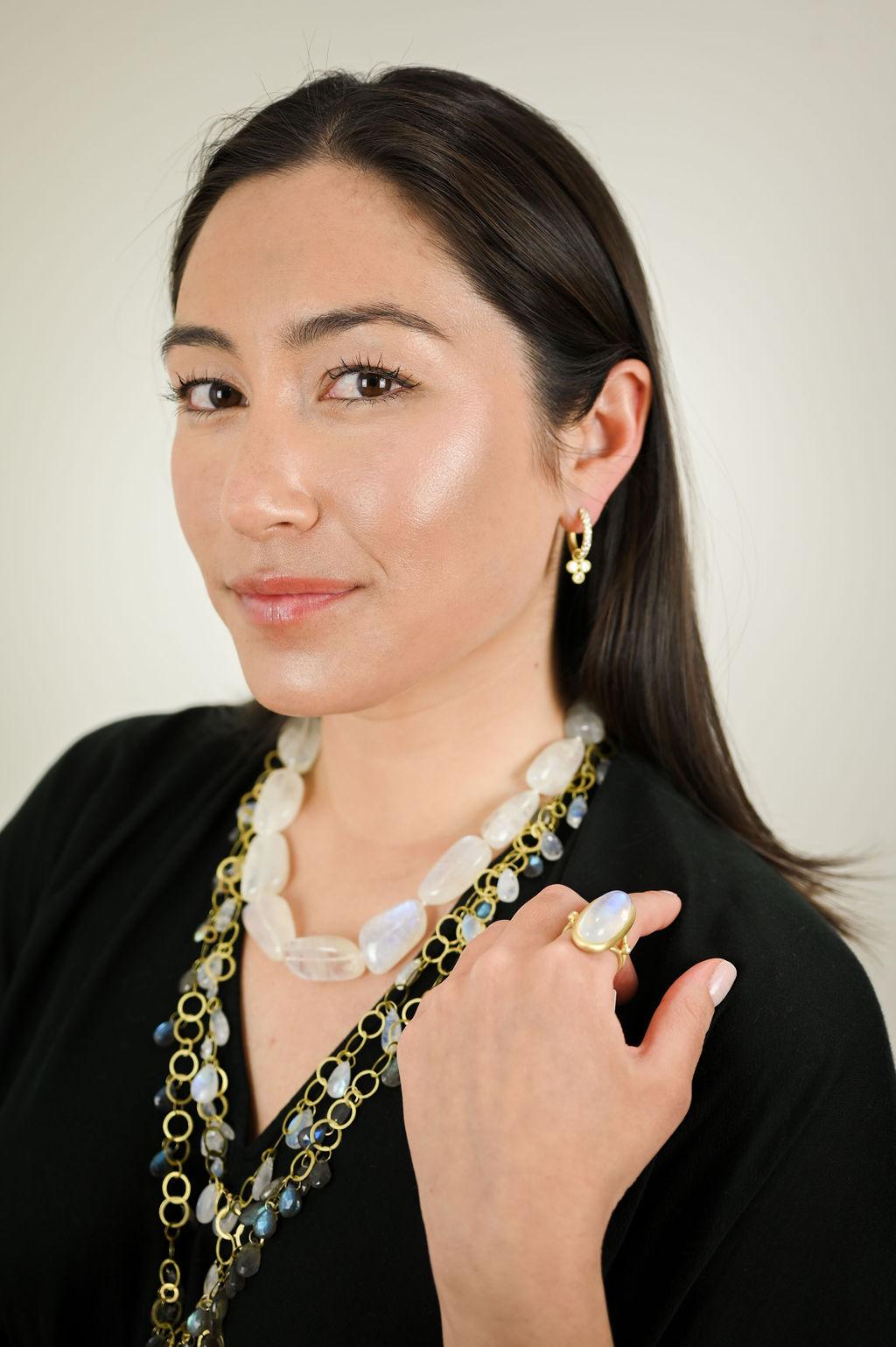 Faye Kim has fashioned the luminous Moonstone - thought to harvest the energy of the moon and promote positive well-being and balance - into a single strand 18 karat gold* bead necklace with a handmade clasp. 

*In Faye Kim's signature 18k green