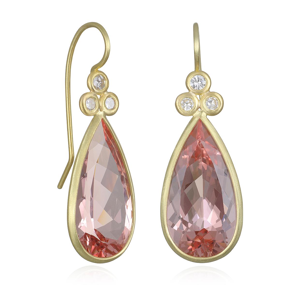 Perfectly matched in color and shape, faceted Morganite pear-shaped drops sparkle in just the right shade of a sophisticated Pink.  Triple diamond accents. Morganite is a variety of 