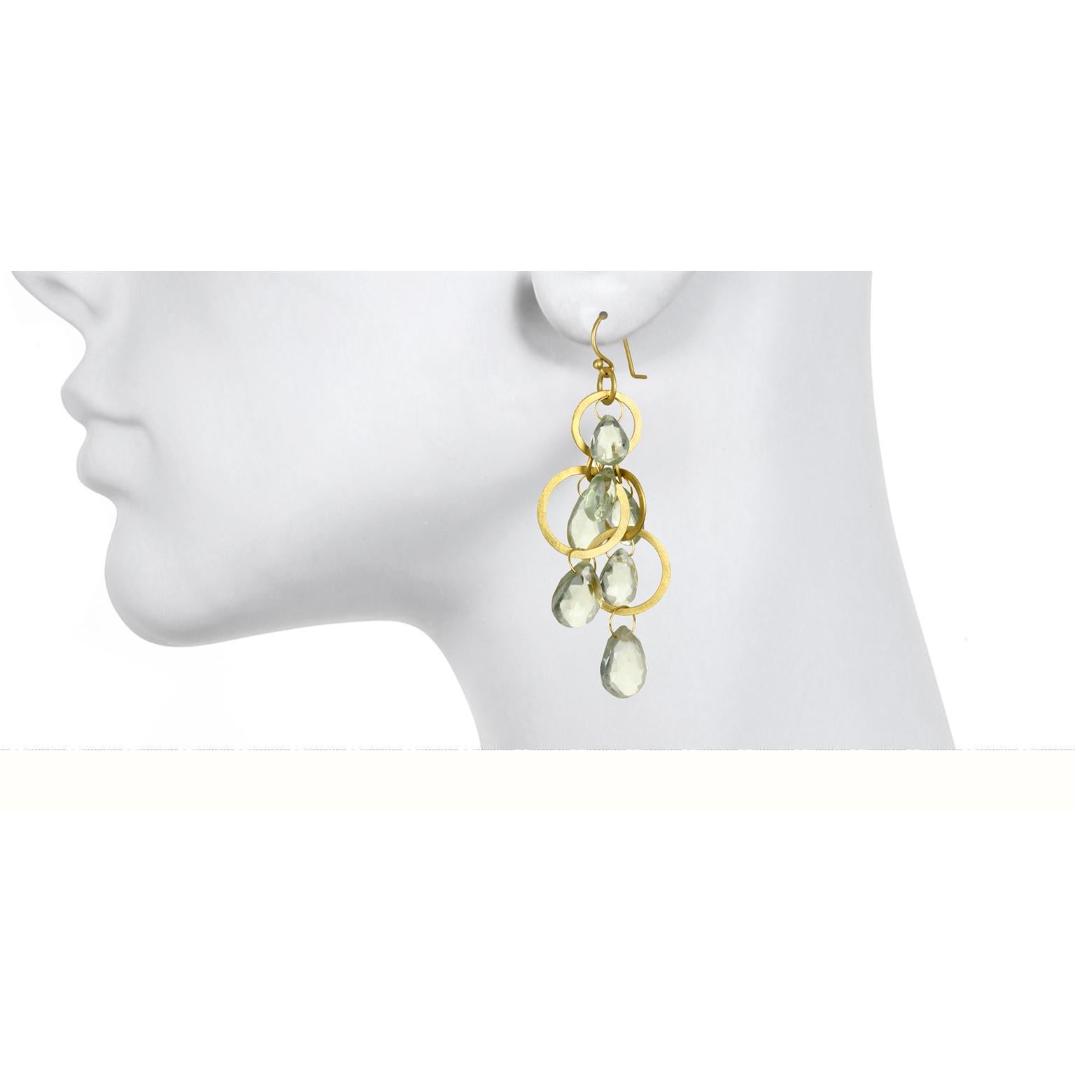 These gorgeous cascading multi loop green amethyst earrings are overflowing with illuminating soft green hues to make a big impact.  Surprisingly lightweight and sure to make a big splash. 
Length 2.5