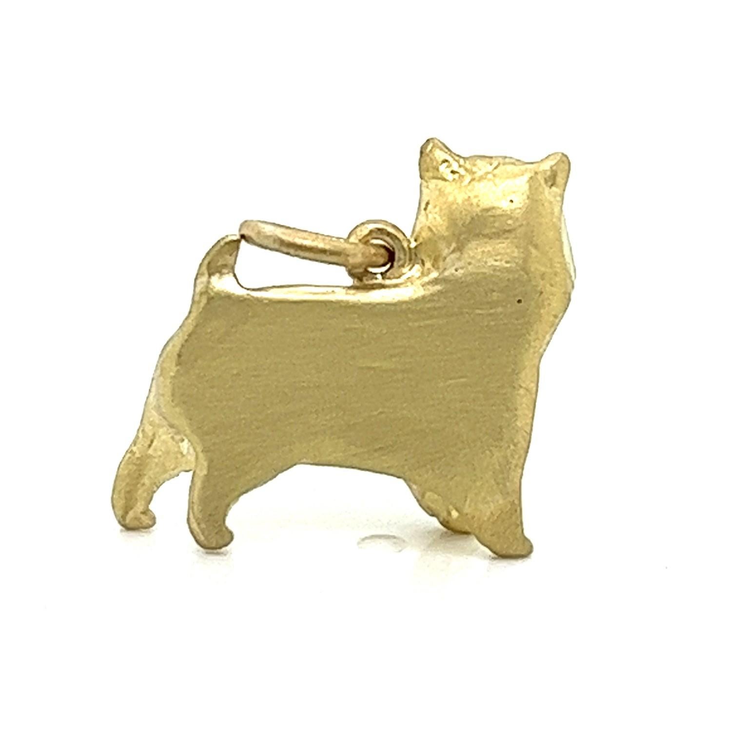 As good as gold: For the Norwich Terrier lover (or any dog lover), this sweet little 18 Karat Gold dog will melt your heart. Wear it alone or layered with other charms and necklaces. 

Diamonds = .02 cts.
Height and Width: 17 x 15mm
Signature