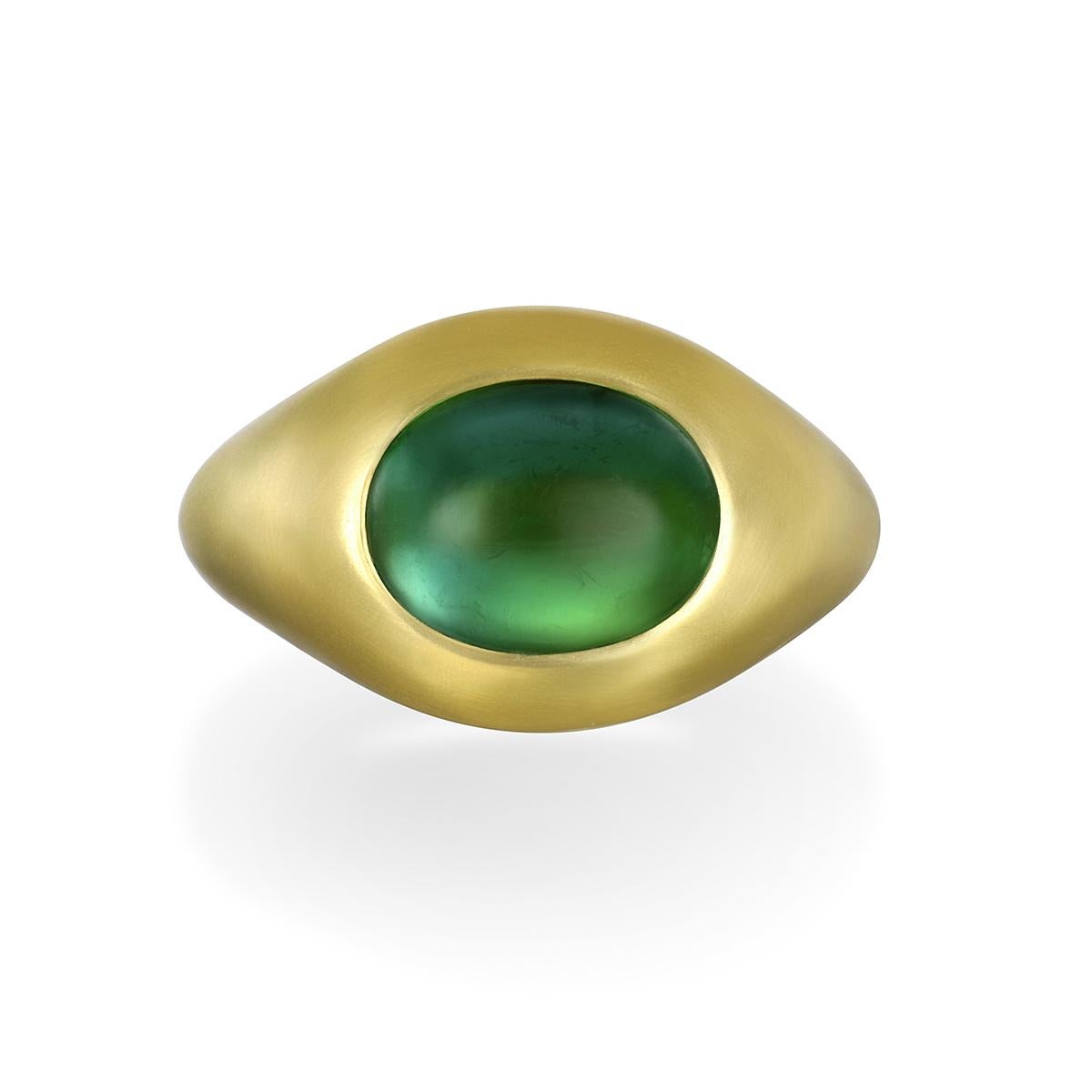 Faye Kim's 18 Karat Gold Oval Green Tourmaline Cabochon Ring, with its mesmerizing green hue and dome setting, is beautifully is matte finished and can be worn for any occasion. 

Green Tourmaline Cabochon 5.35 Carats
Cabochon dimensions 11.5 x