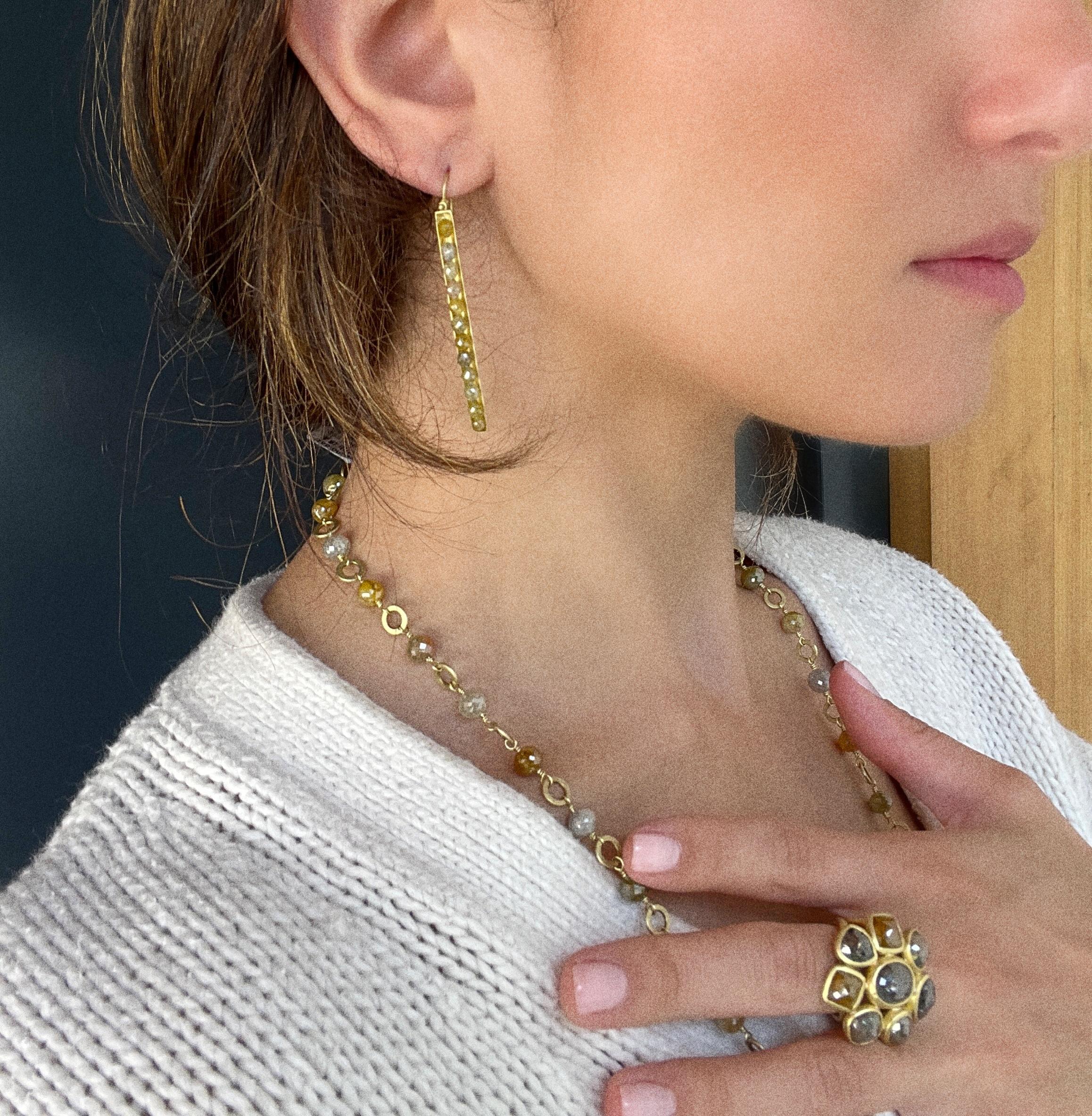 Feminine yet edgy, the matchstick style earrings in 18k gold feature yellow diamonds that are channel set for a clean, sleek look.  The hinge detail provides movement and sparkle. Matte-finished.

Diamonds: natural color 9.24 Carats twt
Length