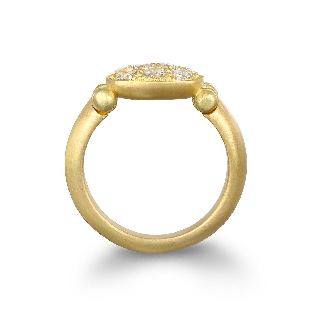 A modern-day take on the Signet Ring, Faye Kim's 18 Karat Gold Diamond Hinged Chiclet Ring sparkles with bright, white pave diamonds. With its flattering chiclet or antique cushion shape, it's a great look worn on any finger and can be stacked with