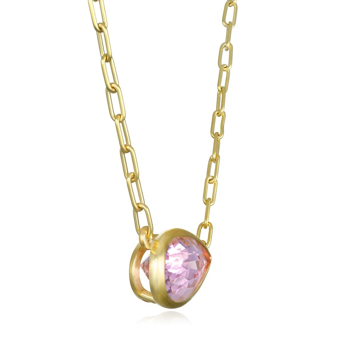 Faye Kim's spectacular 18k Gold Pear Shaped Morganite Pendant Necklace, with its beautiful blush color and open bezel, is attached to a matte-finished paperclip chain necklace. 

Morganite 8.6 cts
Morganite dimensions 19mm x 11mm
Necklace length