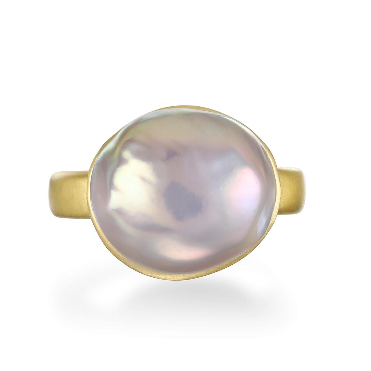 Faye Kim's 18 Karat Gold Pink Baroque Freshwater Pearl Ring is bezel set and highlights the classic beauty of pearls made wearable for today's contemporary styles.

Pearl: 15mm
Size: 6.5 (Can be resized)

Photos show variations on ring, all sold