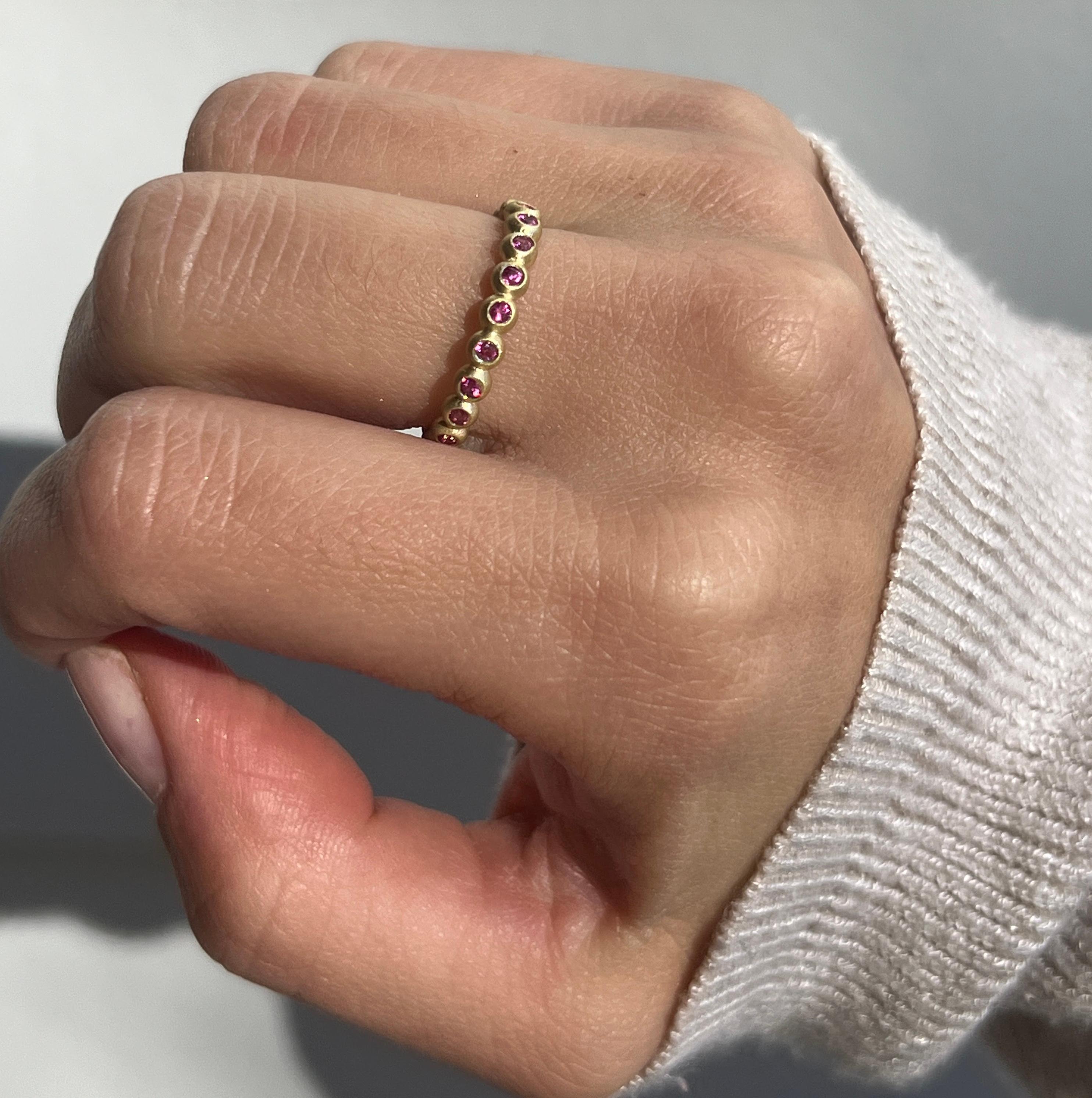 Faye Kim's sparkling Pink Sapphire Granulation Bead Ring is handcrafted in 18 karat gold and matte finished for a contemporary look. Wear alone or stacked with others to express your own unique style. 

Pink Sapphire .40 Carats twt
Band width