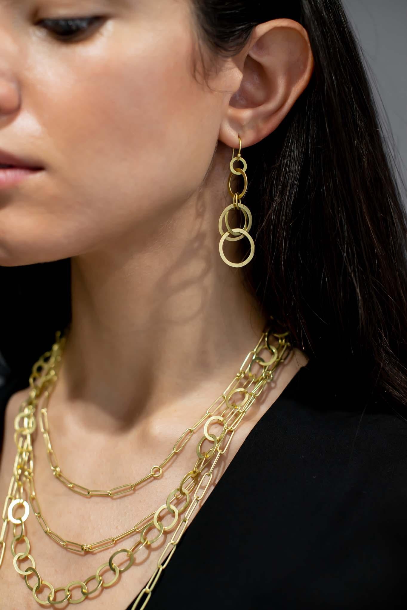 Faye Kim's 18 Karat Gold Large Planished Multi Loop Earrings on hinged ear wires are an instant classic, and can be worn with virtually any outfit, for any occasion. The gold loops are hand planished and matte-finished, adding texture and dimension.