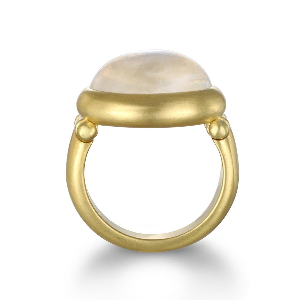 Faye Kim's mesmerizing 18 Karat Gold Rainbow Moonstone Hinged Ring reflects a bluish, milky light. The shape, polish, and matte gold finish enhance the moonstone's striking rainbow effect. 

Moonstone 15.17 cts
Size 7.5 , can be sized

Please