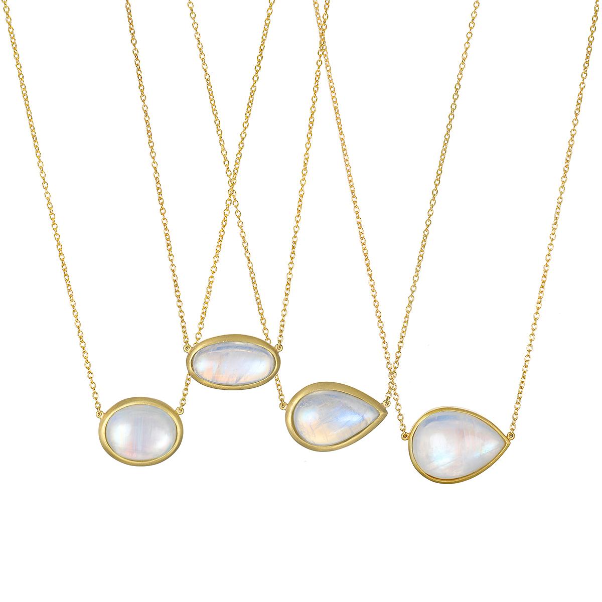 One of a Kind
Faye Kim's Rainbow oval moonstone necklace is full of light and reflects beautiful translucent blue hues. The shape, polish, and matte gold enhances the moonstones striking rainbow effect. Handcrafted in 18k gold* with a classic jump