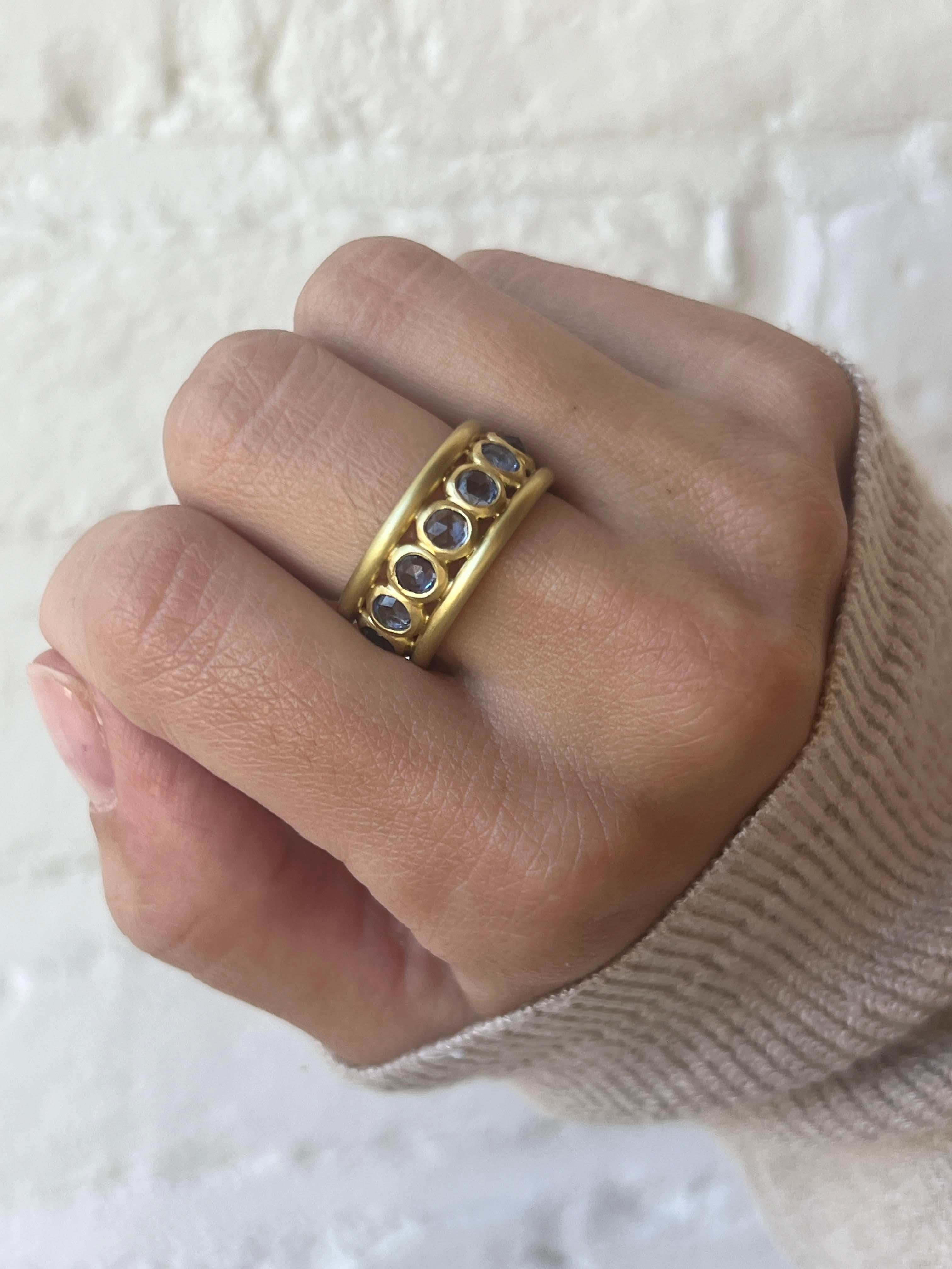 Reminiscent of the past but thoroughly modern in style, this Faye Kim matte-finished eternity ring is handcrafted in 18 karat gold and makes a statement all on its own. Can also be stacked.

Rose cut blue sapphires 4.0 Carats twt
9.6mm Wide  
Size