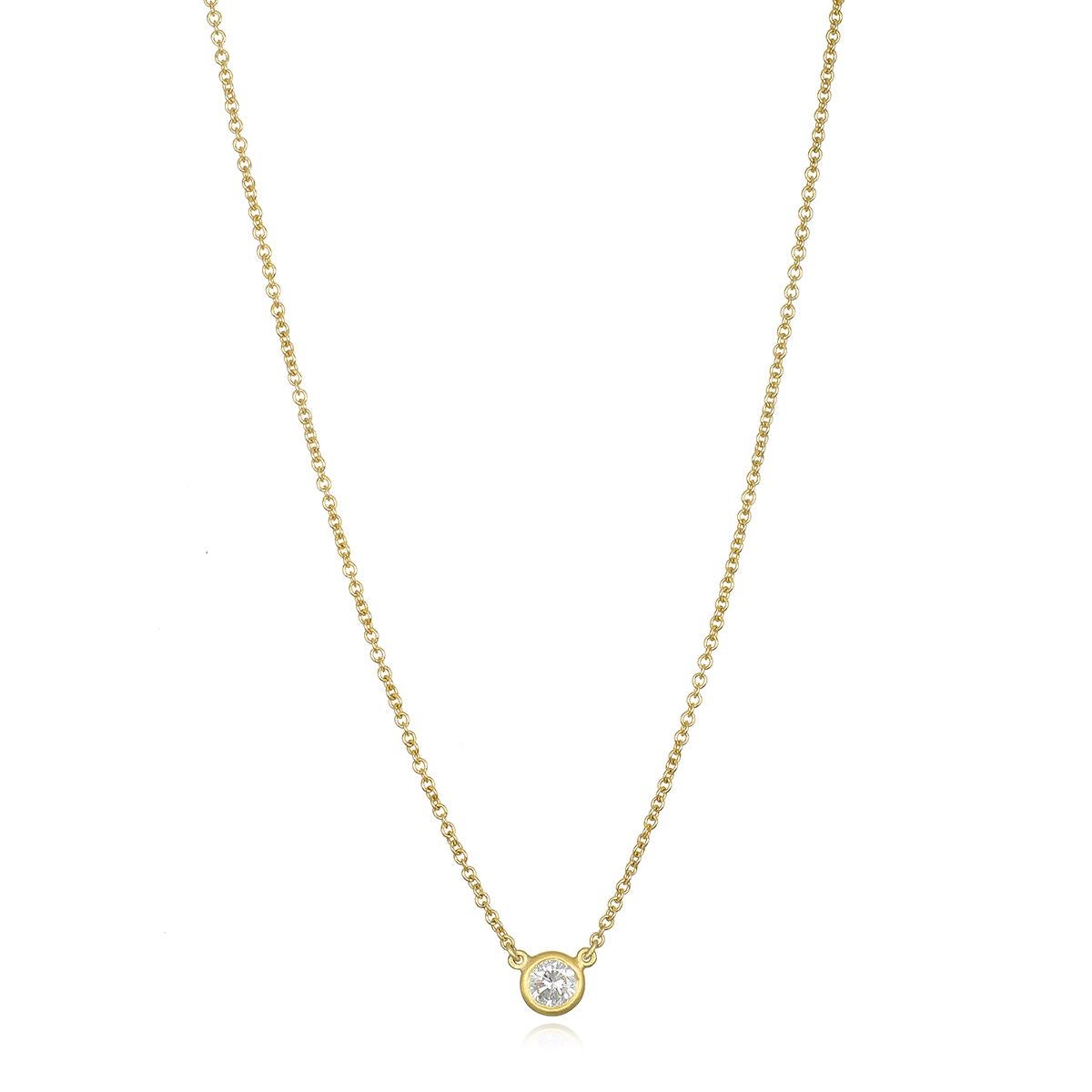 Set in 18k gold, Faye Kim's solitaire diamond necklace features a sparkling round brilliant cut diamond set in a thin clean bezel. Wear alone or layered for a look that is timeless and perfect for every day.  

Diamond .36 Carat
Necklace length