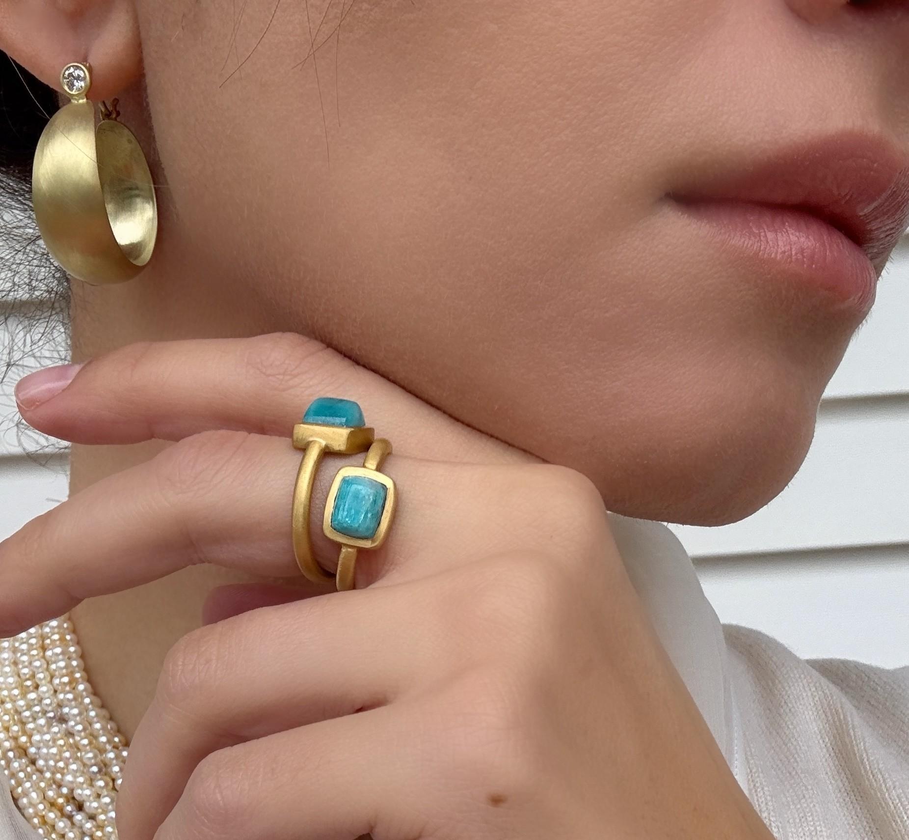 Elegant and sculptural, Faye Kim’s 18k gold synclastic hoops showcase a fluid, hand-formed curve that creates beautiful movement and dimension. Round brilliant-cut diamonds add soft, luminous sparkle at the top of each hoop, offering a refined