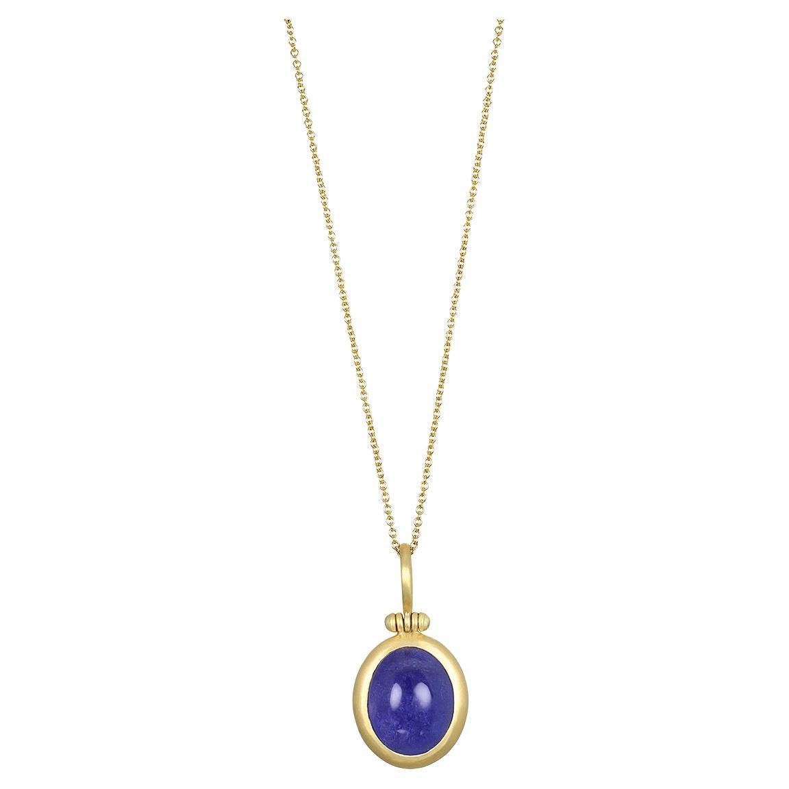 Faye Kim's 18 Karat Gold Tanzanite Cabachon Hinged Ball Pendant, with its striking blue hue, is sure to make a design statement! This unique, one of a kind piece is finished with Faye's signature clean bezel and hinged bail. 

Photos also show