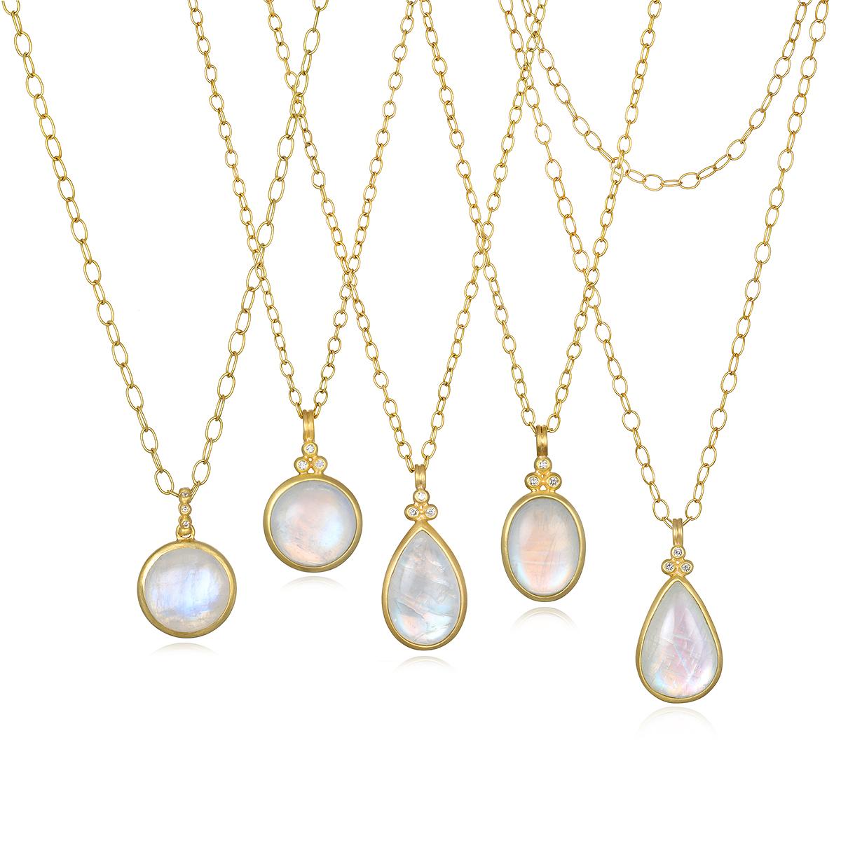 This beautiful Faye Kim Triple Diamond Oval Moonstone Bezel Pendant is full of light and reflects beautiful translucent blue hues. The shape, polish, and matte gold finish enhances the moonstone's striking rainbow effect. Handcrafted in 18 karat