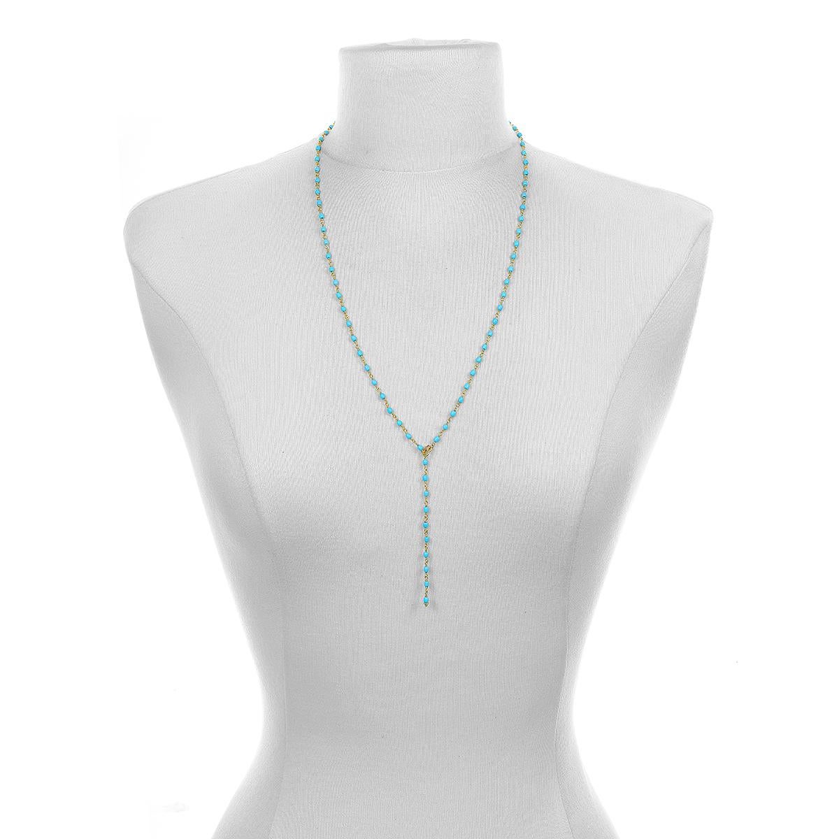 Handwrapped in 18 karat gold*, Faye Kim's Turquoise Mini Oval Bead Necklace can be adjusted to be worn at various lengths, including as a lariat, making it the perfect complement to any outfit. The stones' striking hue pops beautifully against