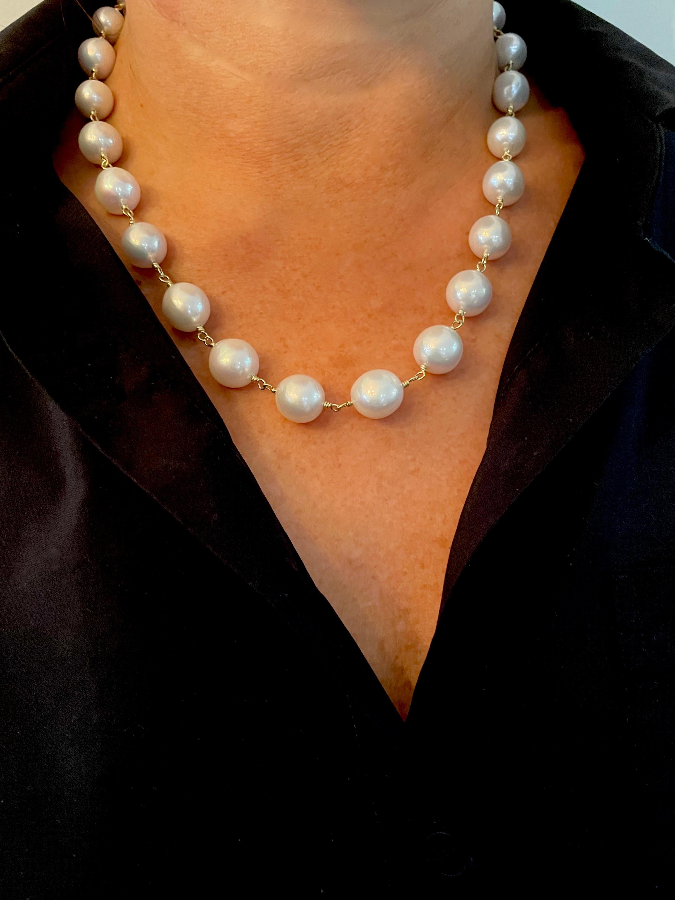 Meticulously finished in 18k gold*, lustrous freshwater pearls are hand-wrapped to create a timeless pearl chain that has adorned fashionable women throughout time. With oversized, slightly off-round pearls and a large handmade clasp, the look is