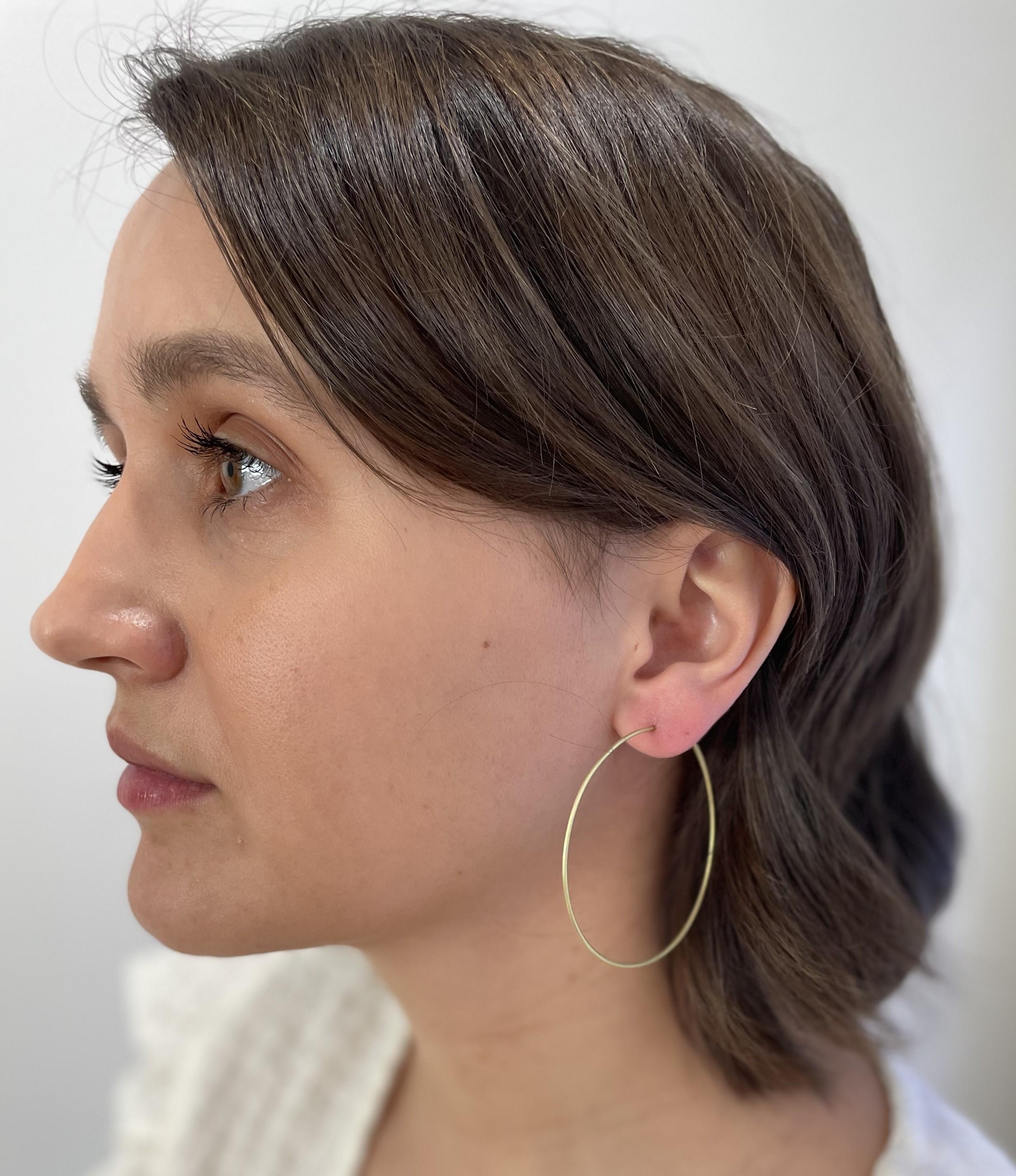 Faye Kim's 18 Karat Gold handmade wire hoops are a must-have for every jewelry wardrobe. Casual, chic and wearable every day, the hoops give endless opportunities to change your look with different drops, sold separately.

Hoops: 2