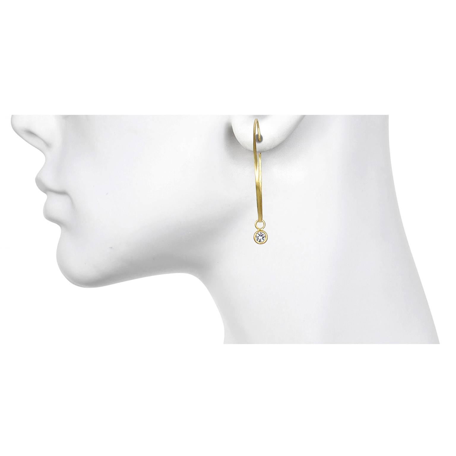 Diamonds and Gold - two classic items combined to create the perfect pair of earrings to wear day in and day out.  On their own, these Faye Kim 18 Karat Gold hoops are easy to wear and go with just about everything. The added diamond drops will