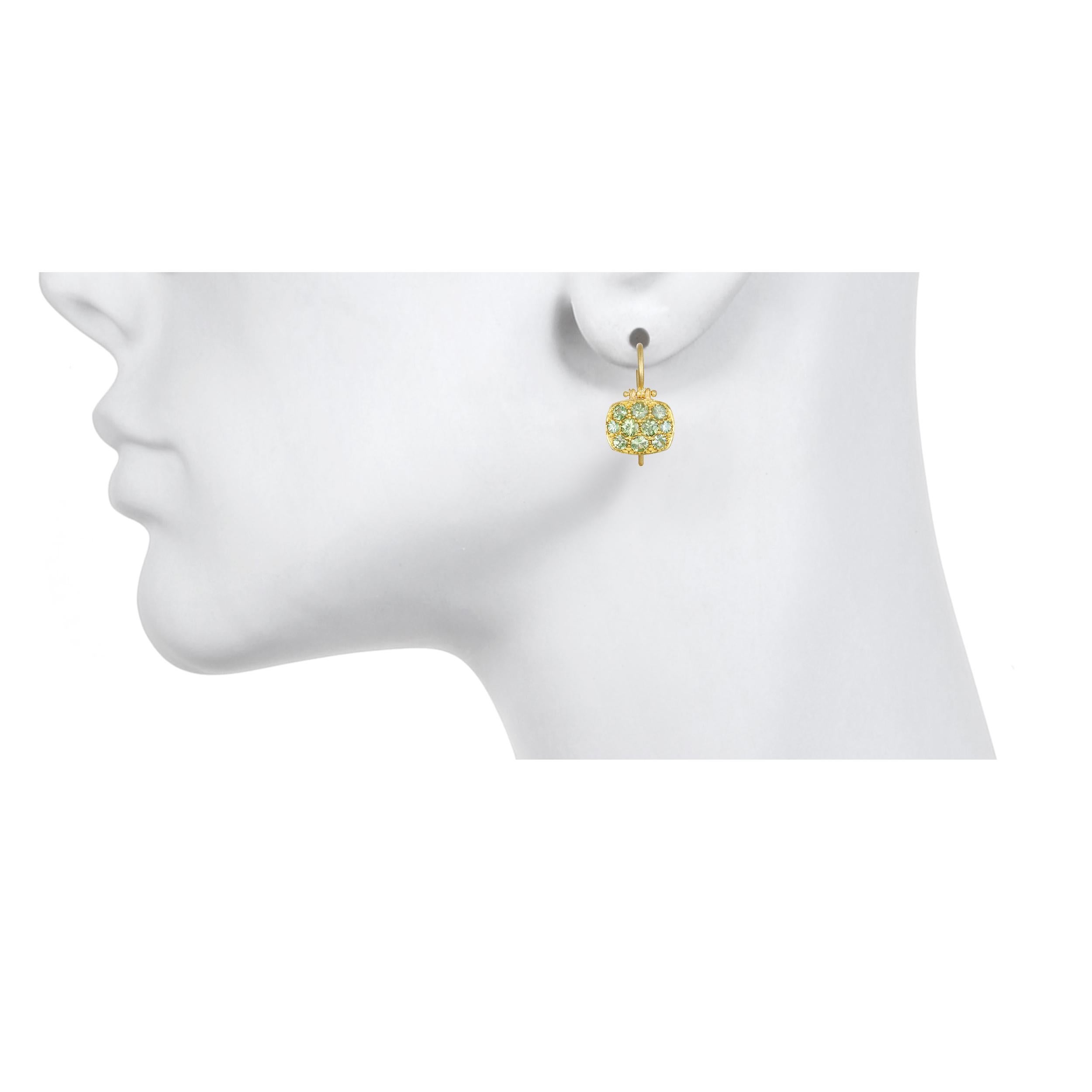 Faye Kim 18 Karat Green Sapphire Chiclet Earrings

These bright and effervescent green sapphire chiclet earrings have just enough sparkle to get noticed but with understated elegance.  Hinged for movement, uniquely shaped and light-weight make these