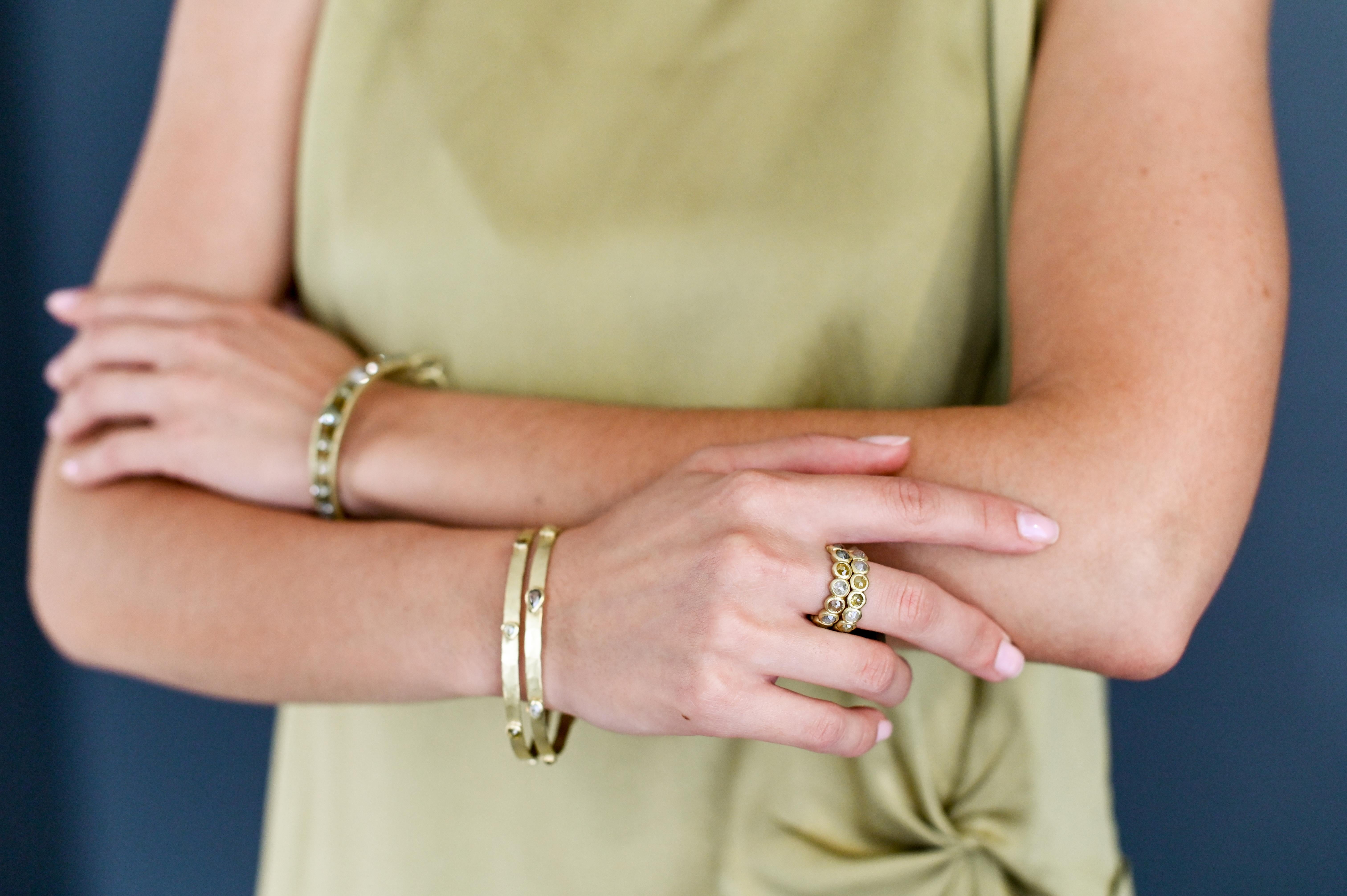Faye Kim's 18 Karat Gold Rose Cut Milky Diamond Bezel Eternity Rings offer varying hues of the diamonds that make each handcrafted ring unique. The colors range from silver/grey and yellow to a soft blush making it easy to combine with other bands