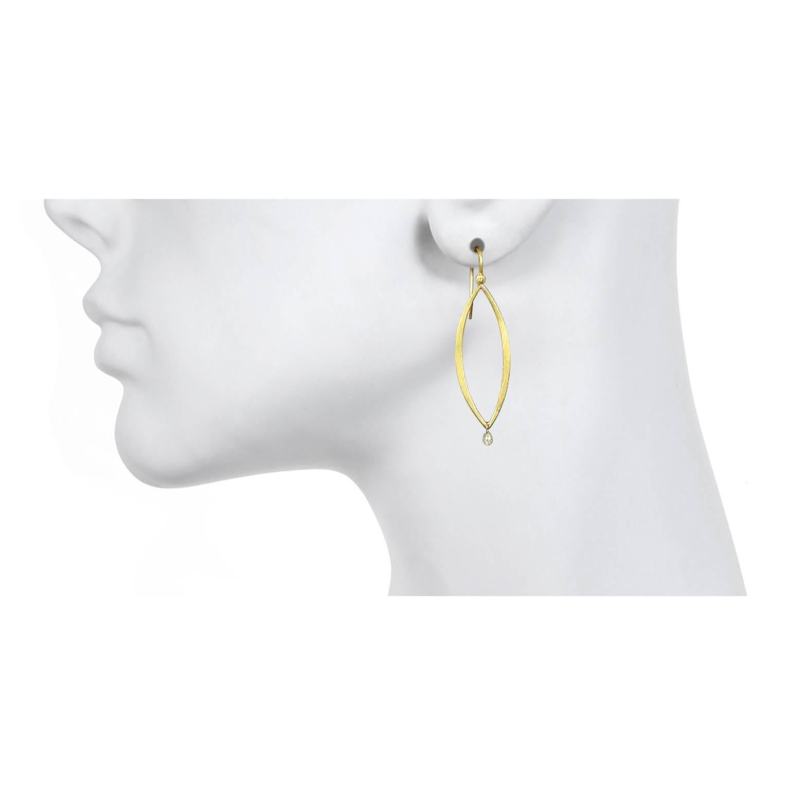 Faye Kim's 18K gold open marquise earrings with raw diamond drops are bold yet understated.  Clean lines and the raw diamond briolette drops define these earrings that are essential in every modern woman's jewelry wardrobe.

Diamonds .43 carats twt 