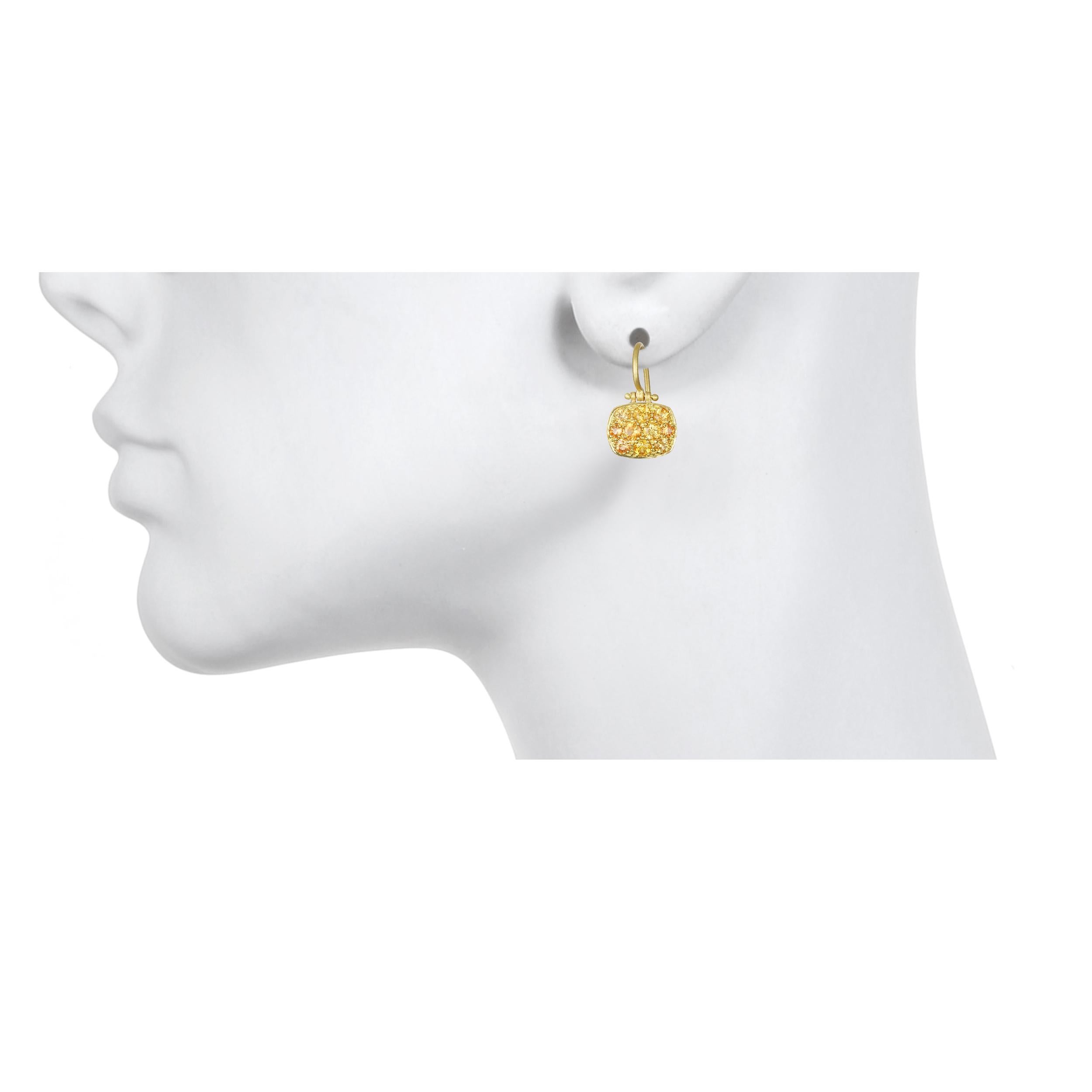 Faye Kim 18 Karat Orange Sapphire Chiclet Earrings

These bright orange sapphire chiclet earrings have just enough sparkle to get noticed but with understated elegance.  Hinged for movement, flattering shape, and light-weight make these your new