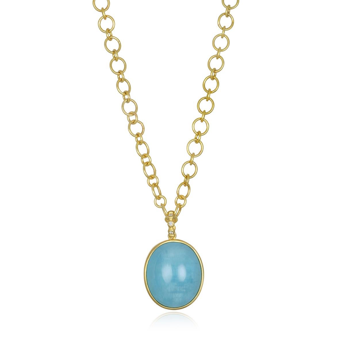 Faye's 47.3-carat milky Aquamarine oval cabochon pendant is a true One-of-a-Kind piece handcrafted and bezel set in 18K gold.  The soft, ethereal blue is enhanced by the white diamonds in the bail.  
Pendant Length: 1.5