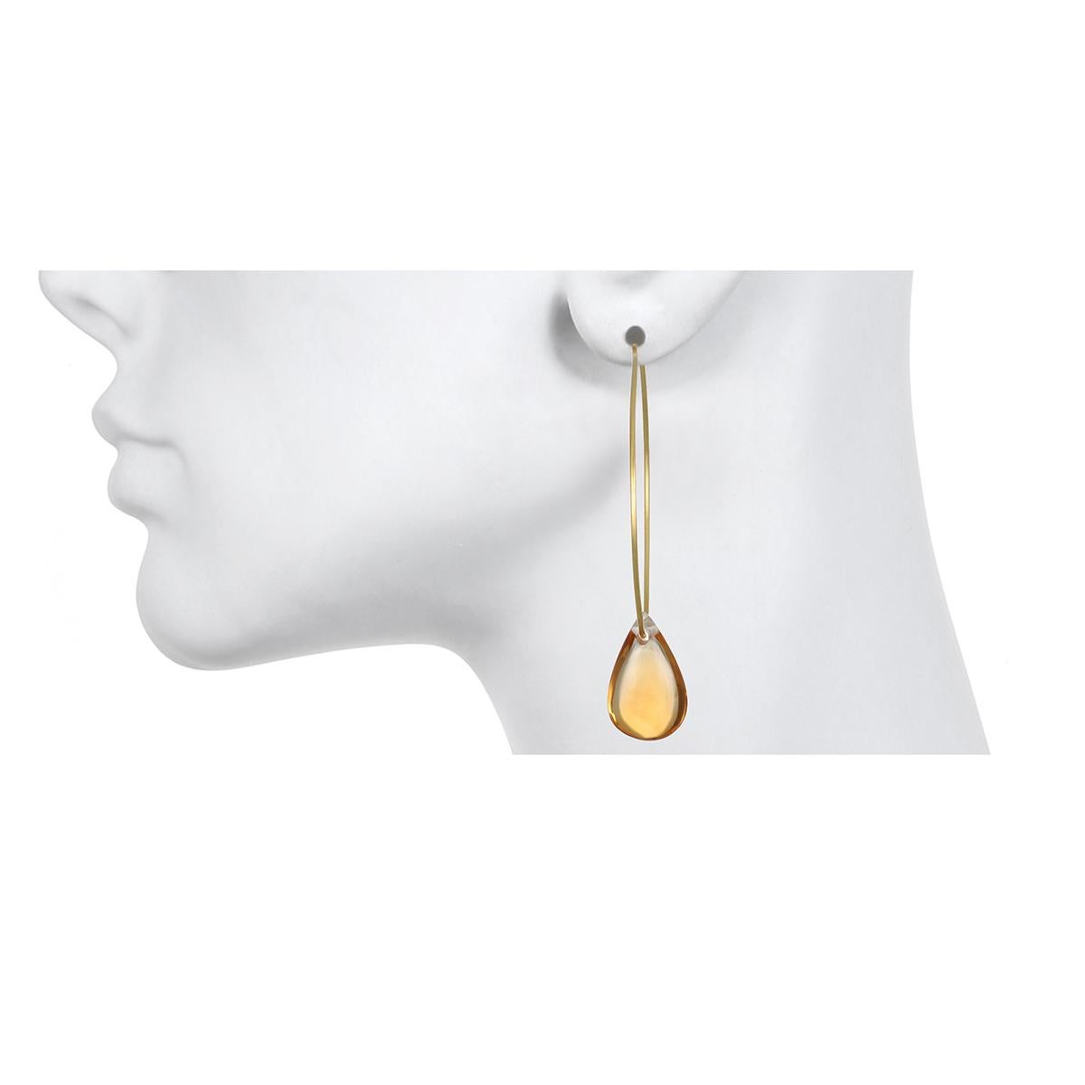 Faye Kim 18 Karat Wire Hoops with Citrine Briolette Drops

Smooth Citrine briolettes float through Faye's 18k gold wire hoops.  These gorgeous gemstones have a warm, golden hue and look great from every angle.   

Hoops: 1.75