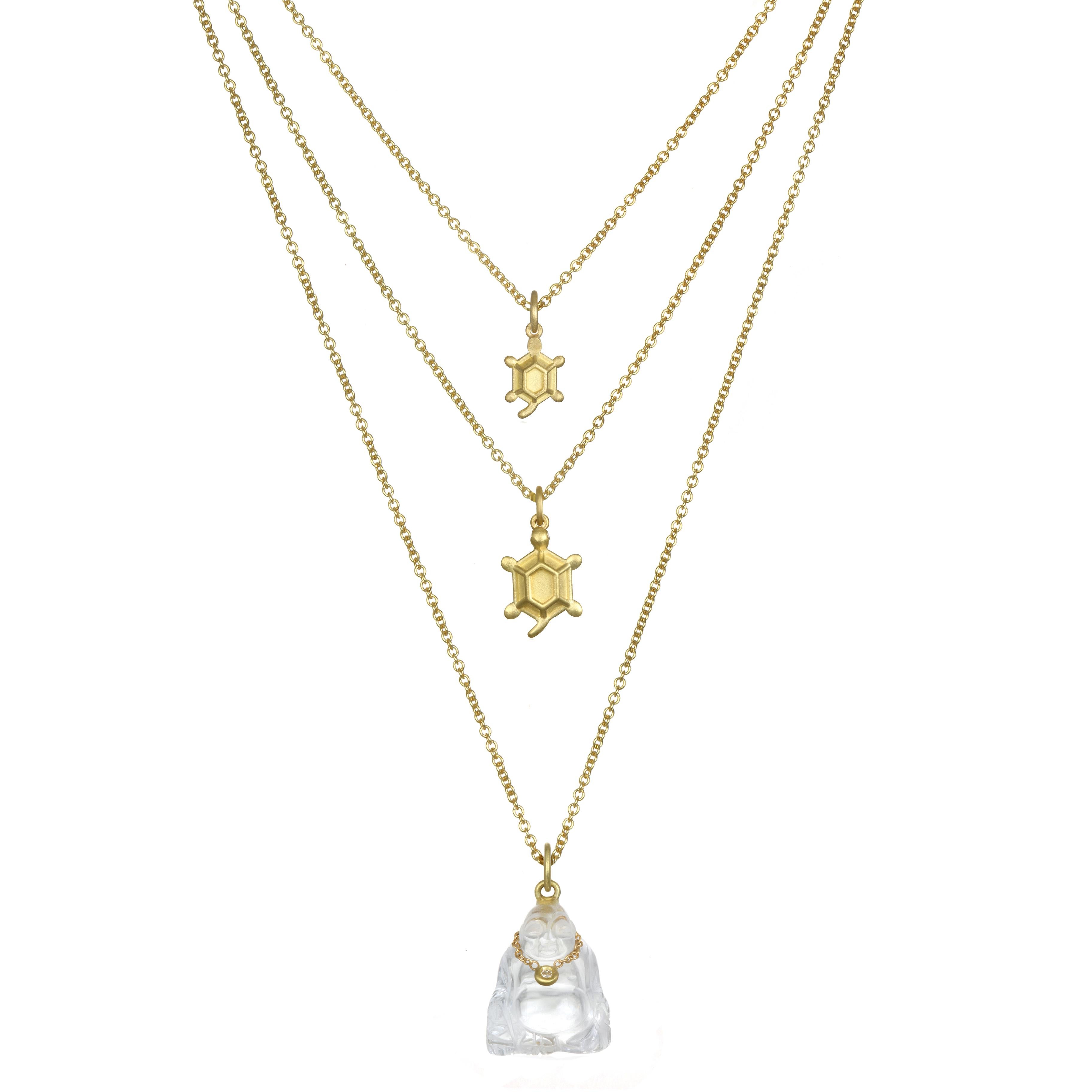 For the turtle lover - symbolizing good health and longevity. 
This Faye Kim baby turtle charm is finely crafted in 18 karat gold and hangs on an adjustable cable chain.

Turtle length: .5