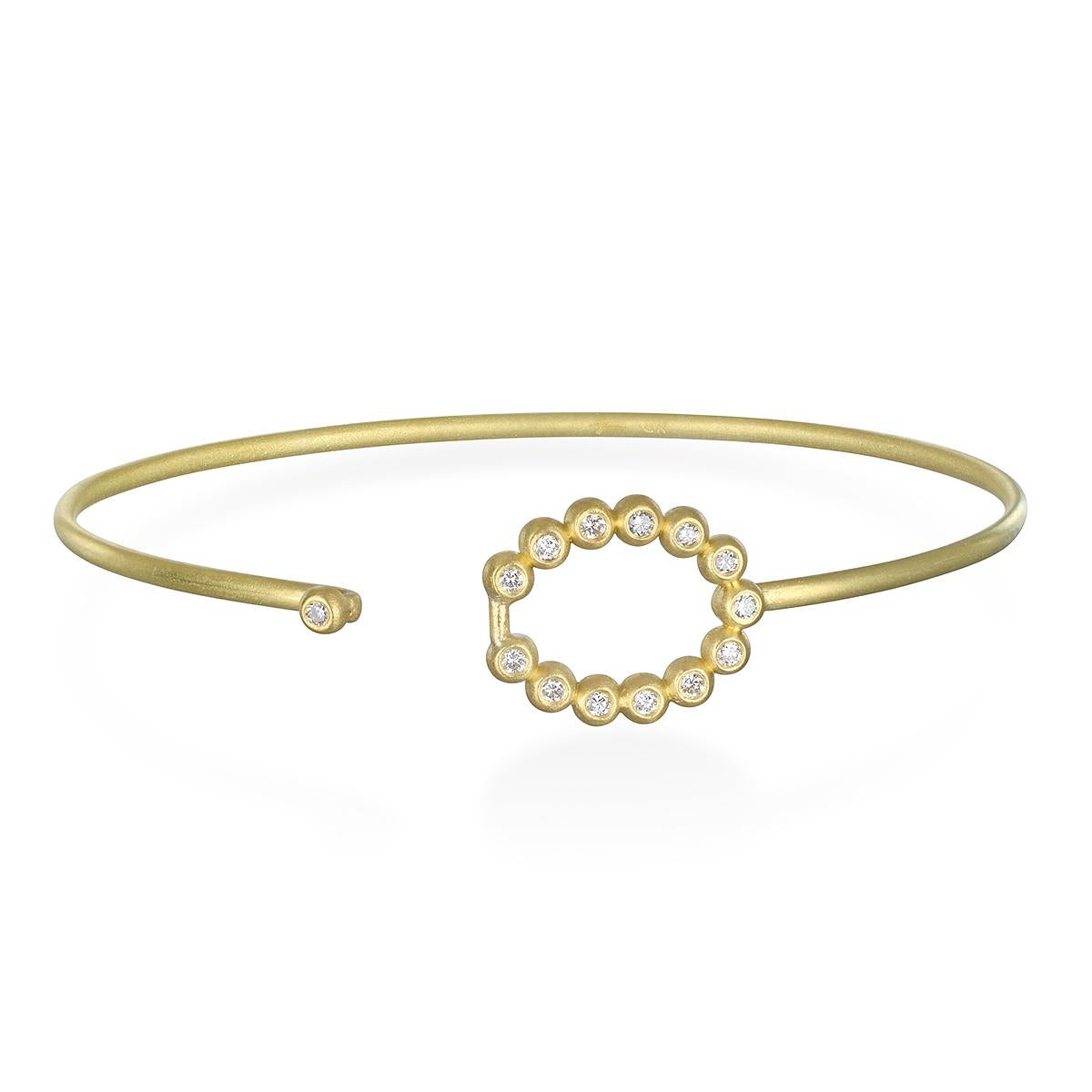 Understated beauty! Faye Kim's handcrafted in 18k gold, the Oval diamond motif doubles as the clasp. Perfect to wear on its own or great to stack with other bangles.

Bangle Dimensions: LxW 2.5