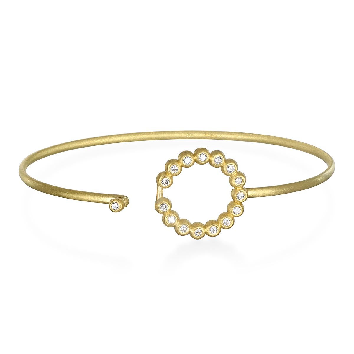 Understated beauty! Faye Kim's handcrafted in 18k gold, the Round diamond motif doubles as the clasp. Perfect to wear on its own or great to stack with other bangles.

Bangle Dimensions: LxW 2.5