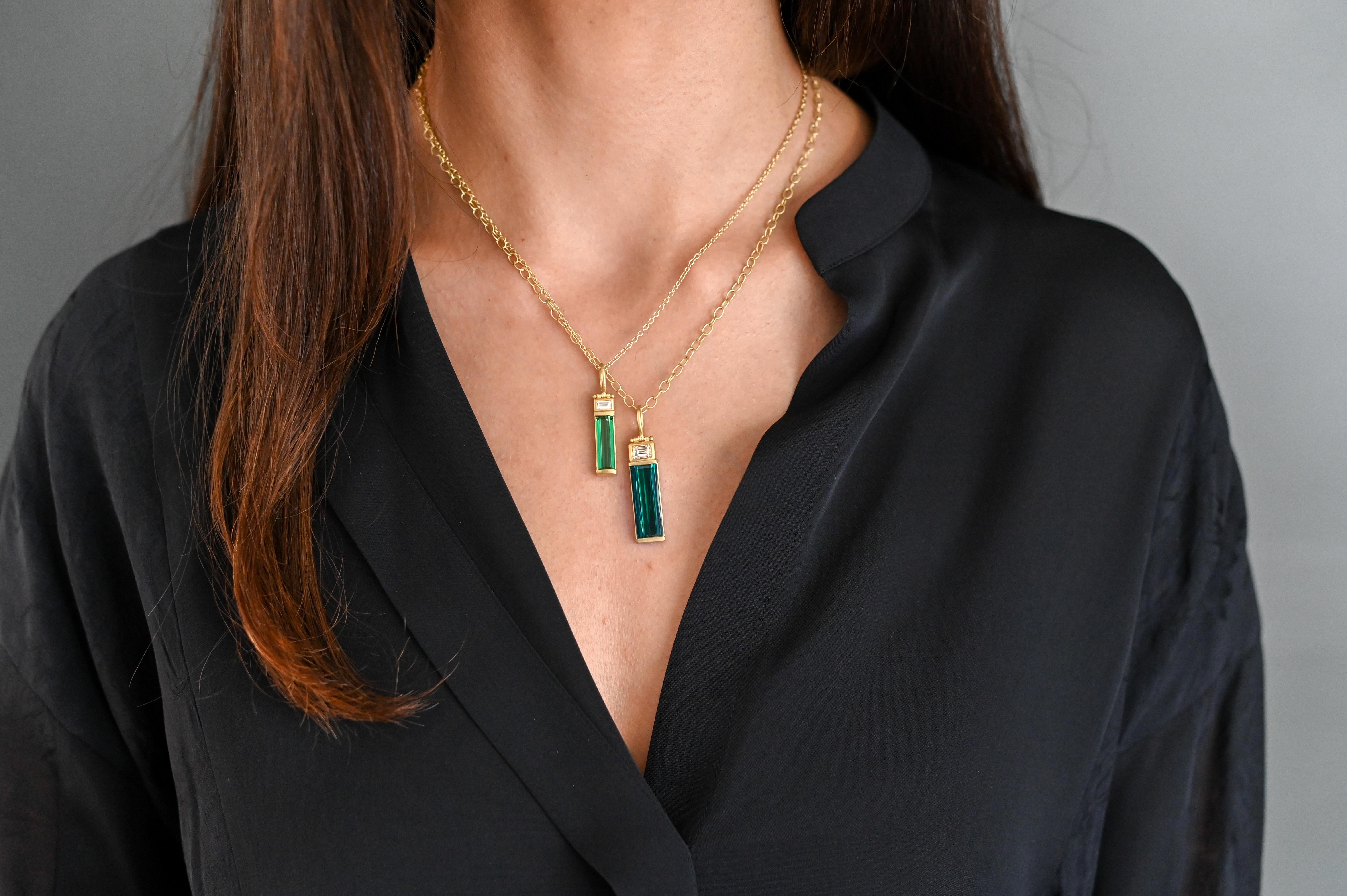 One of a kind and unique, Faye Kim's Tourmaline Bar pendant features a beautiful Blue Tourmaline with a touch of a green undertone. The elongated emerald cut highlights the natural beauty of the intense, even color, and is further highlighted by the