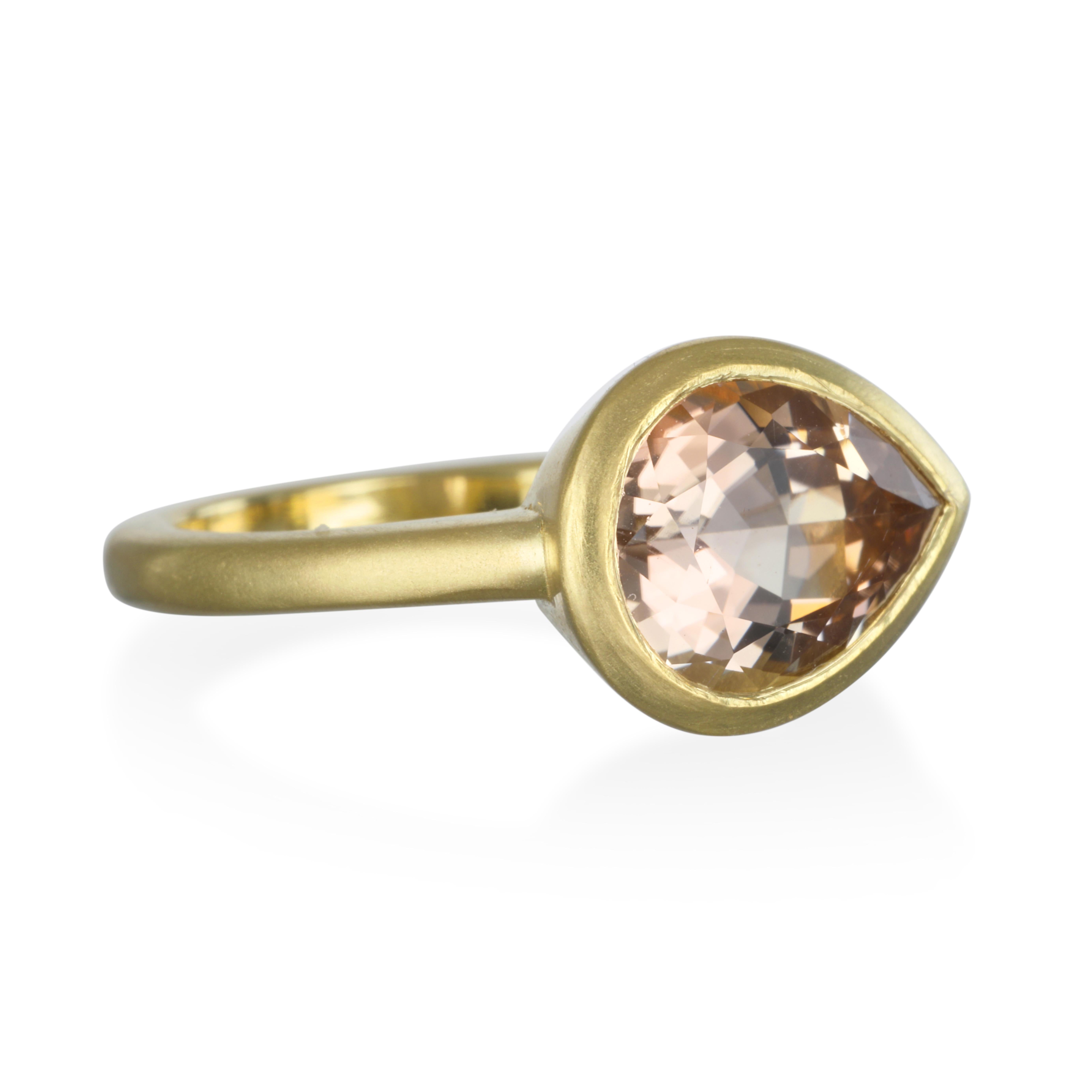 Faye Kim's Pear-Shaped Champagne Tourmaline Ring in 18k Gold* is set in a clean bezel and set East/West in a contemporary style. A fresh and modern take on single stone rings.

Size 7
Champagne Tourmaline 3.82 carats

*In Faye Kim's signature 18k