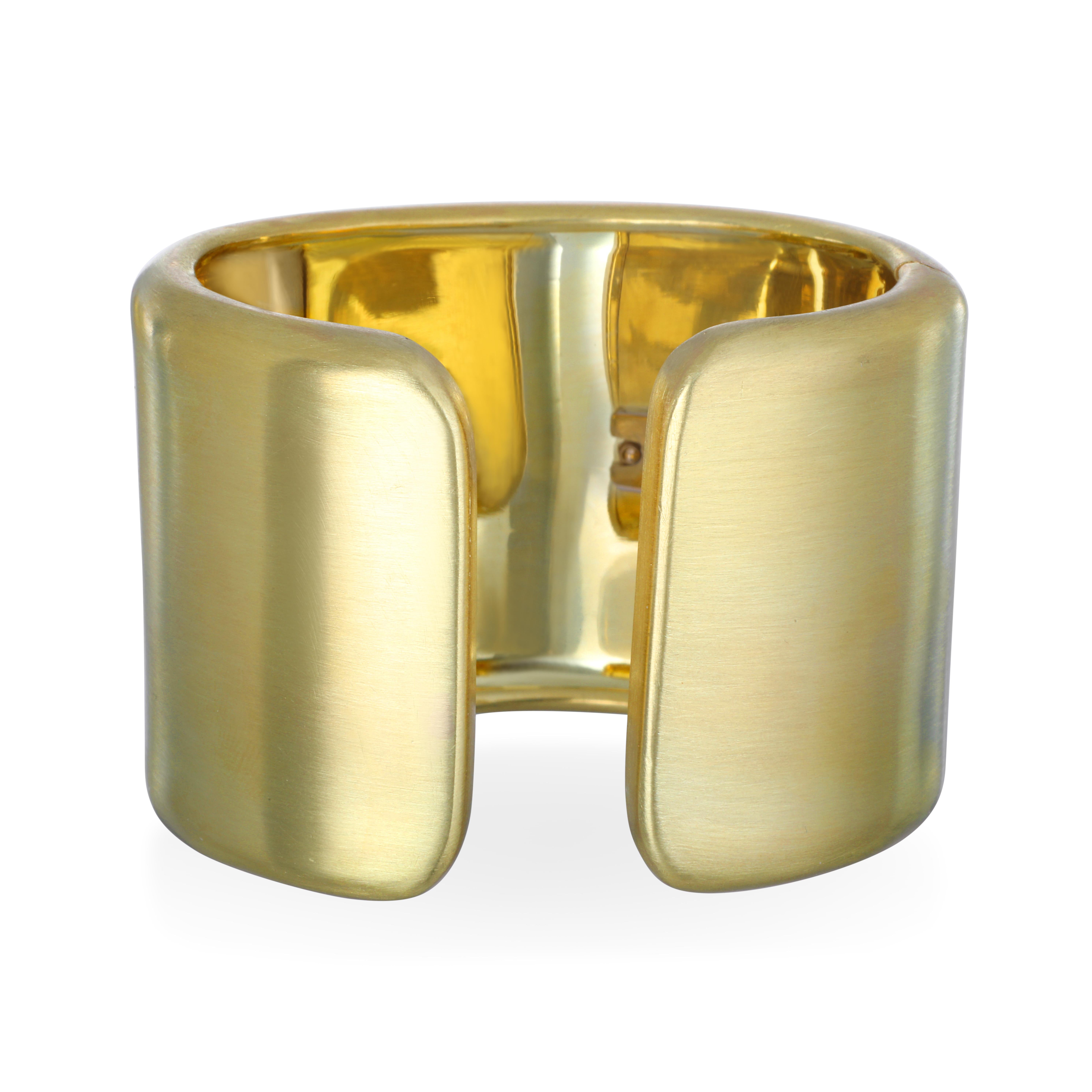 Expert craftsmanship, design, and luxury come together in Faye Kim's handcrafted gold cuff.
Fabricated in solid 18k green gold, with a matte finish, this cuff exudes glamor and sophistication. Hinged for comfort and fit. Also available in a high