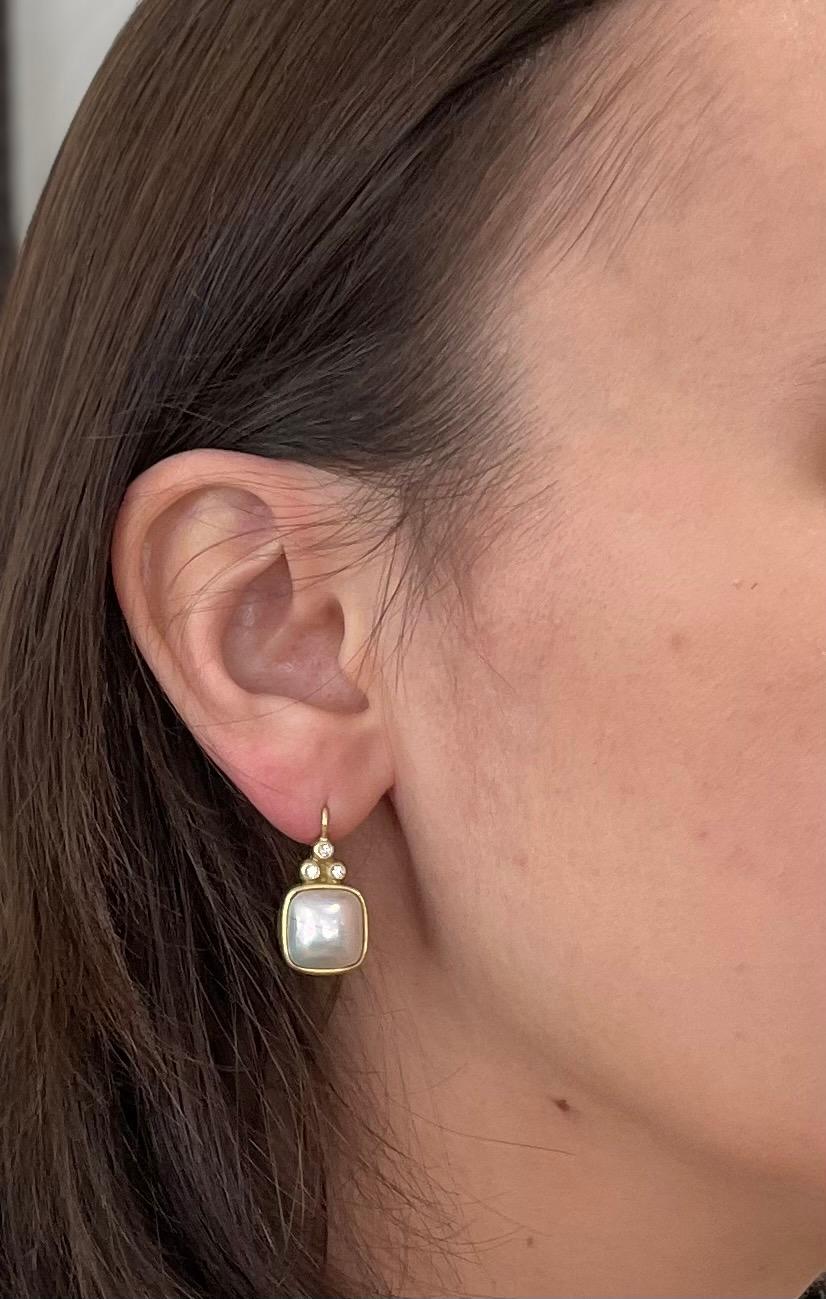 A classic combination of diamonds and pearls. Faye Kim's mabe pearl earrings with triple diamonds are bezel set in 18k gold with lever backs. AAA Gem quality mabe pearls have a beautiful luster and very desirable rose overtones. 
Length x Width: 