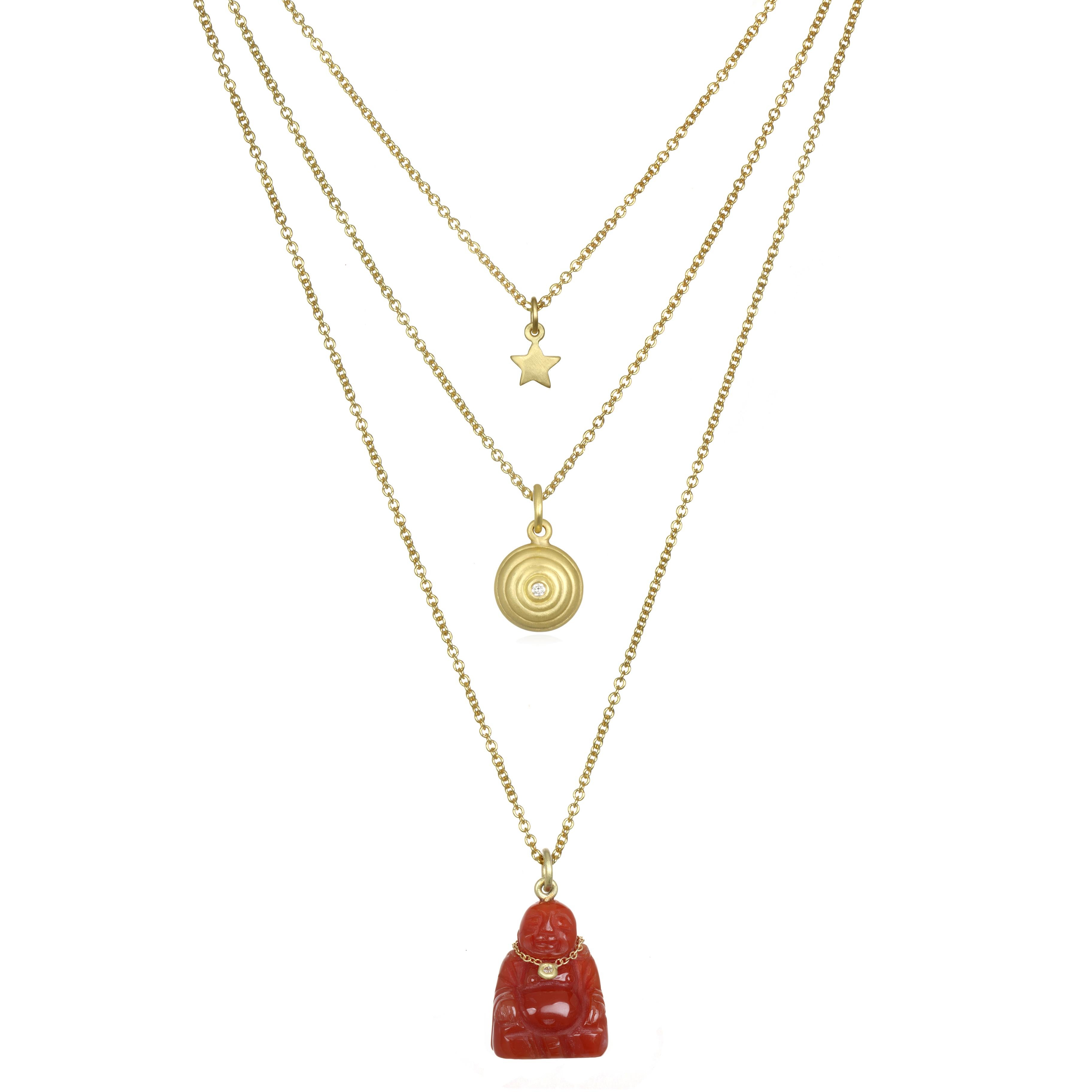 A symbol of longevity, enlightenment and love our Carnelian buddha pendant is complete with its very own diamond necklace. It is sure to add a distinctive sparkle in your life! Sold on 16-18