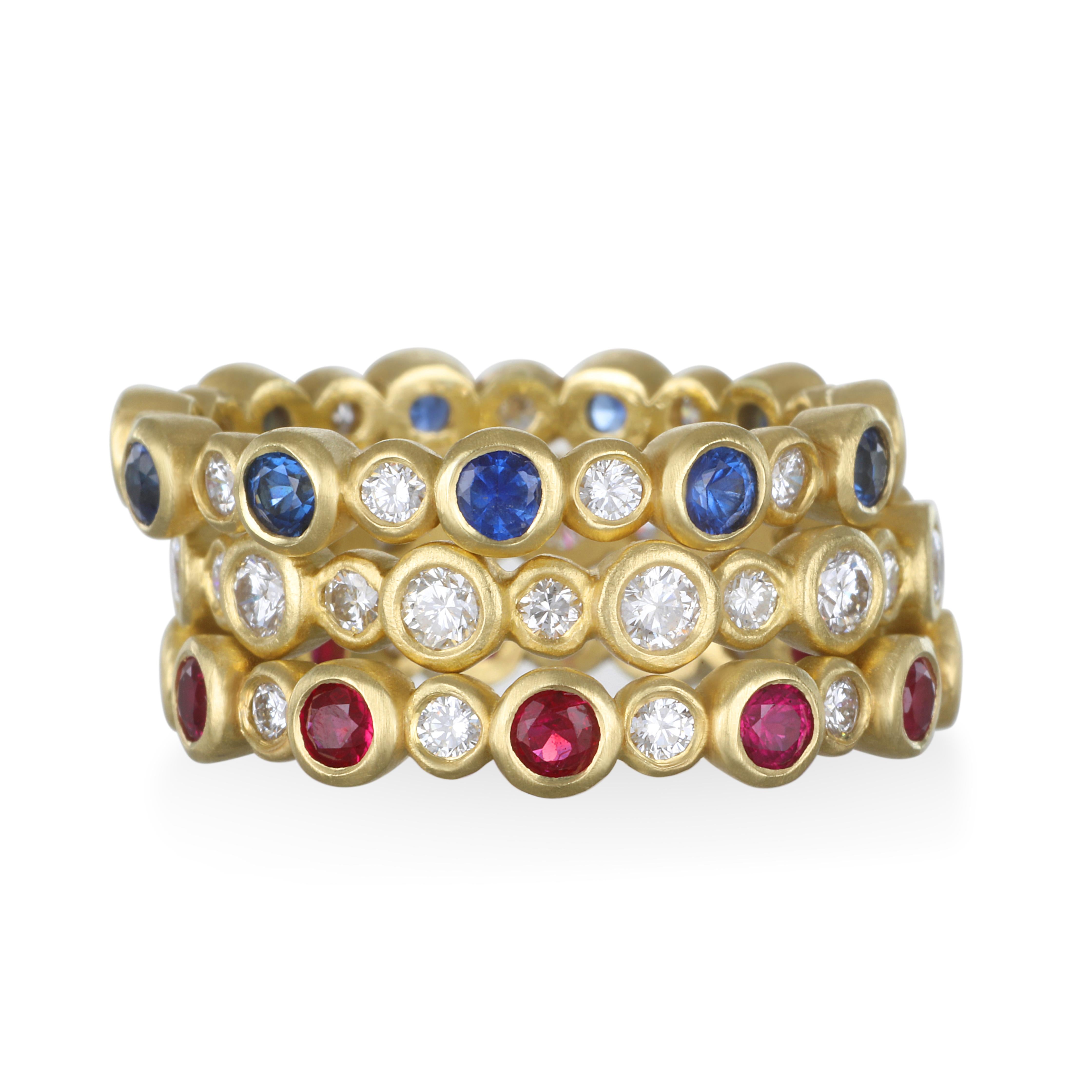 Great for stacking, Faye Kim's classic eternity band has bezel set diamonds and faceted blue Sapphires in 18k gold.  Wear alone or stack with other colors.  This ring is also available with Rubies and all diamonds.
Size: 7.5
Sapphires: .79