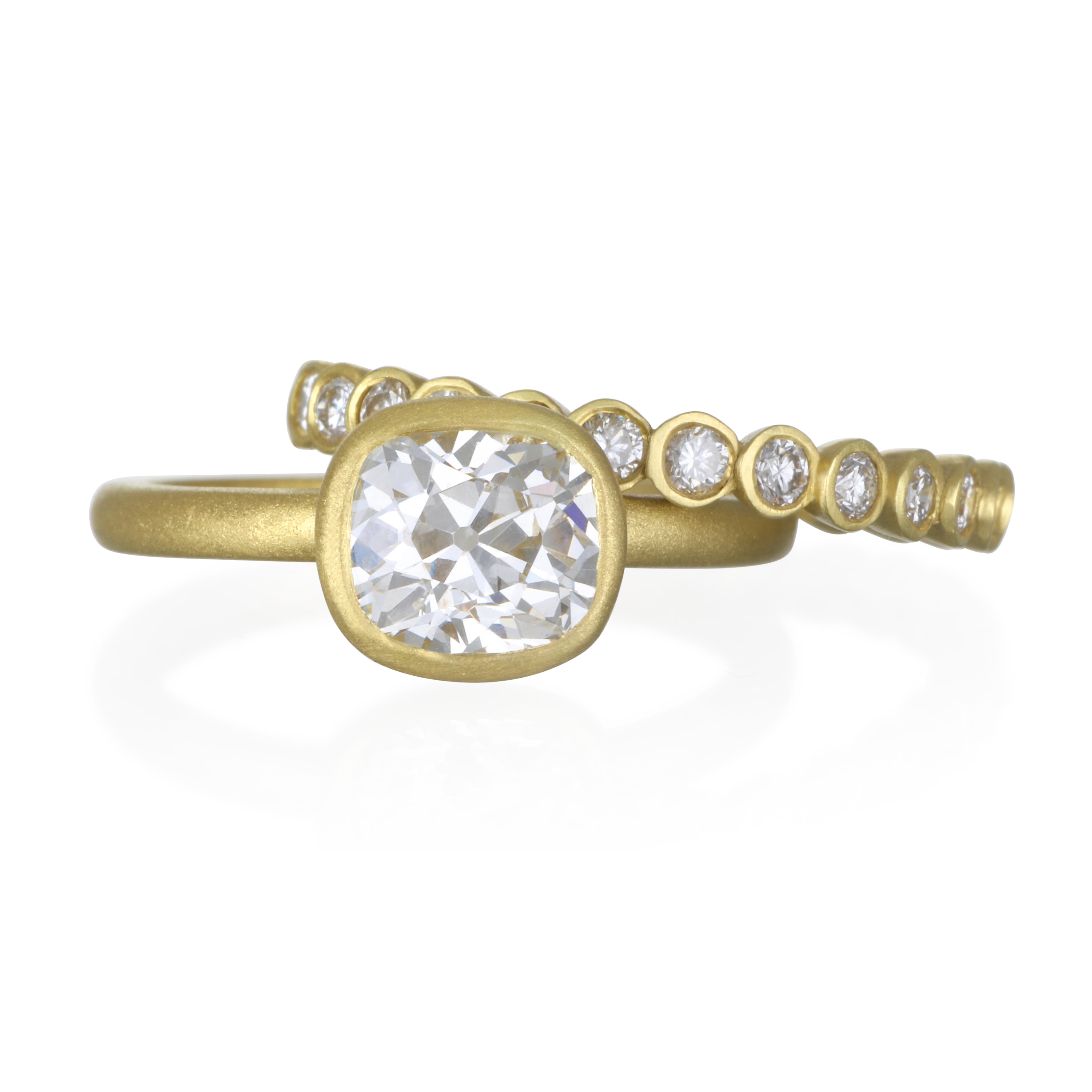 Faye Kim's 18k gold diamond bezel ring with a matte finish.
Bright, white diamonds set in individual bezels for a clean
and contemporary feel.  

Diamonds:  1.04 Carats twt
Width: 2.7 MM
Size:  7
