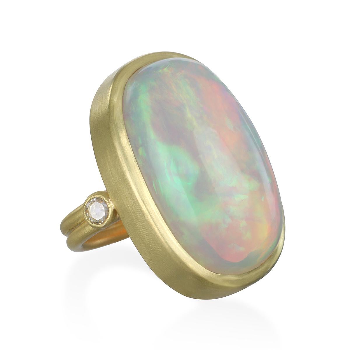 Unique, one-of-a-kind statement ring.
Fabricated in Faye Kim's signature 18k green gold, the unique shape and cut of this Ethiopian Opal is highlighted to stand out and shine brightly with the addition of white rose cut diamonds.
Size 7.25
Ethiopian